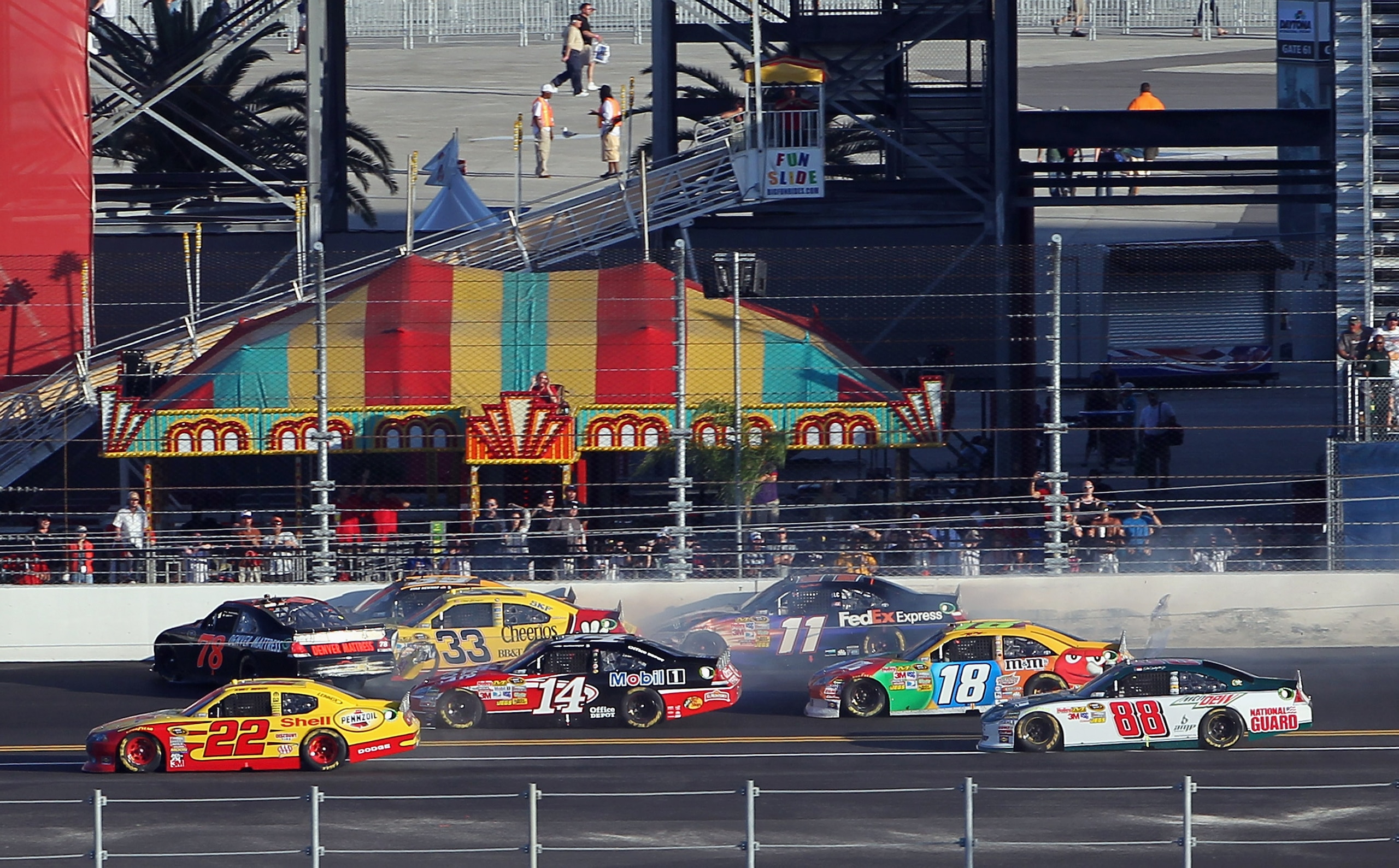 DAYTONA BEACH, FL - FEBRUARY 20:  Regan Smith, driver of the #78 Furniture Row Racing Chevrolet, spins out in front of competitors causing a crash on the backstretch on the 196th lap during the NASCAR Sprint Cup Series Daytona 500 at Daytona International