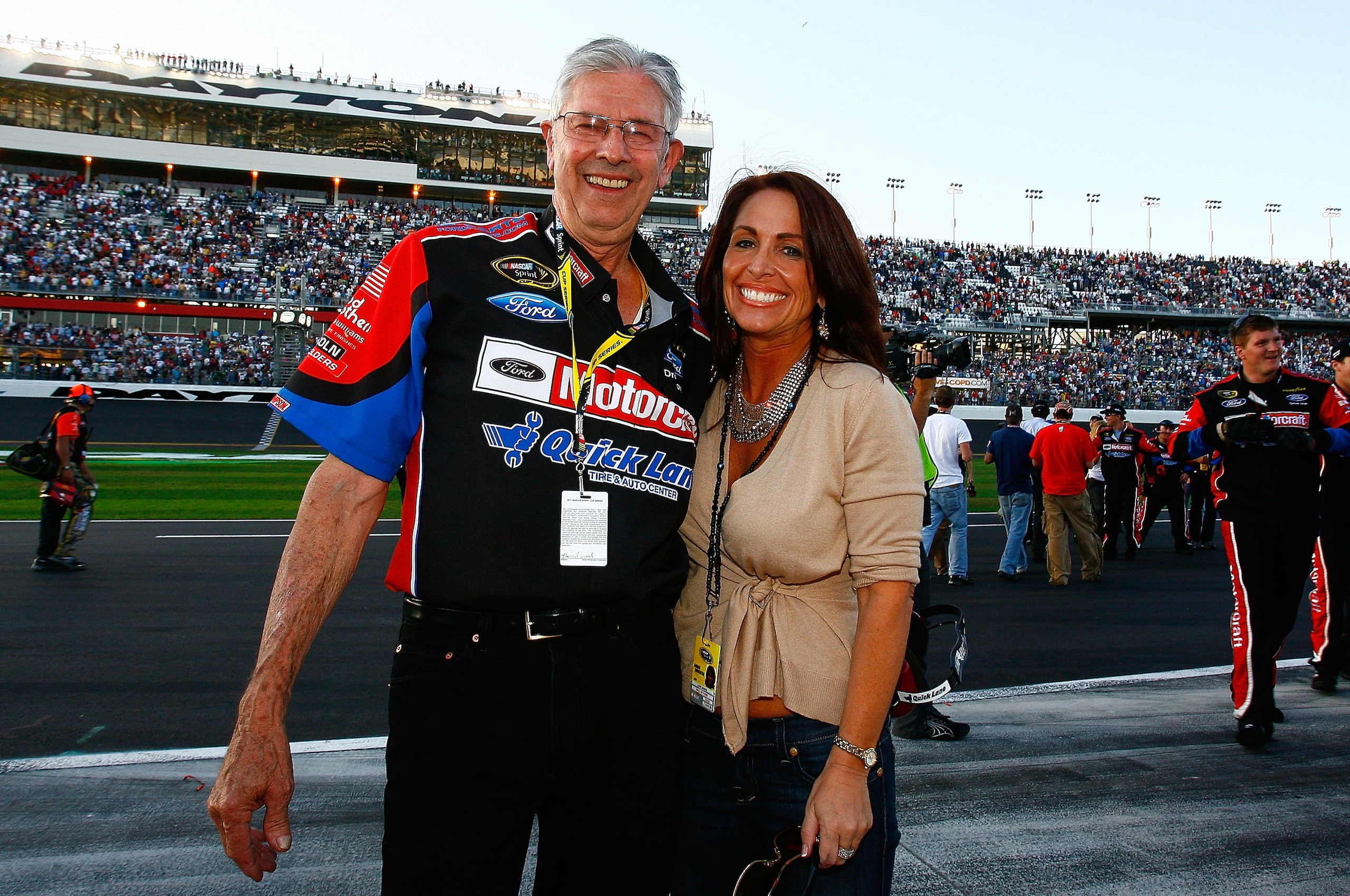 DAYTONA BEACH, FL - FEBRUARY 20:  NASCAR legend Leonard Wood celebrates Lori Banks with after Trevor Bayne, driver of the #21 Motorcraft/Quick Lane Ford, won the NASCAR Sprint Cup Series Daytona 500 at Daytona International Speedway on February 20, 2011 i