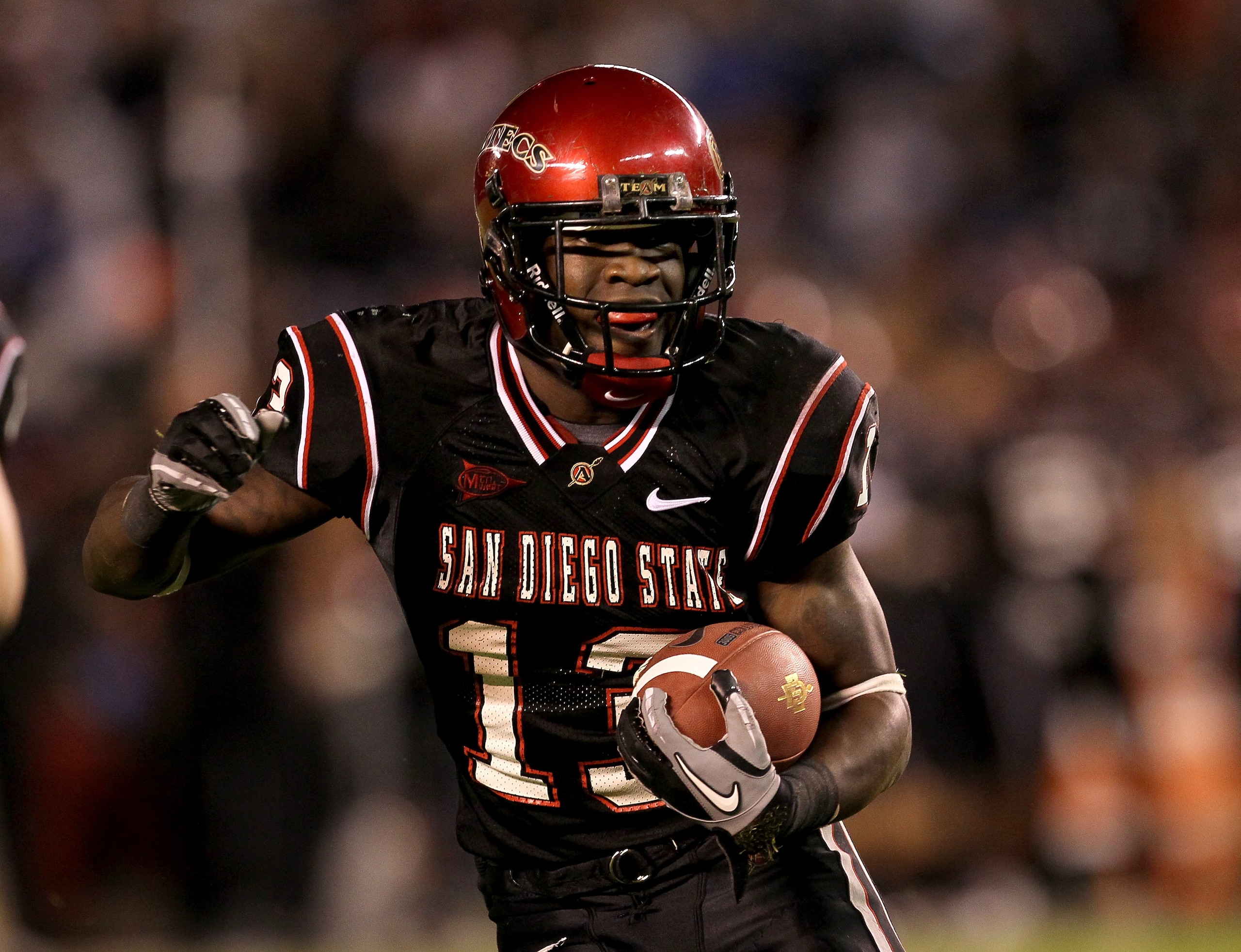 SAN DIEGO - NOVEMBER 20:  Running back Ronnie Hillman #13 of the San Deigo State Aztecs carries the ball on a five yard touchdown run in the second quarter against the Utah Utes at Qualcomm Stadium on November 20, 2010 in San Diego, California.  (Photo by