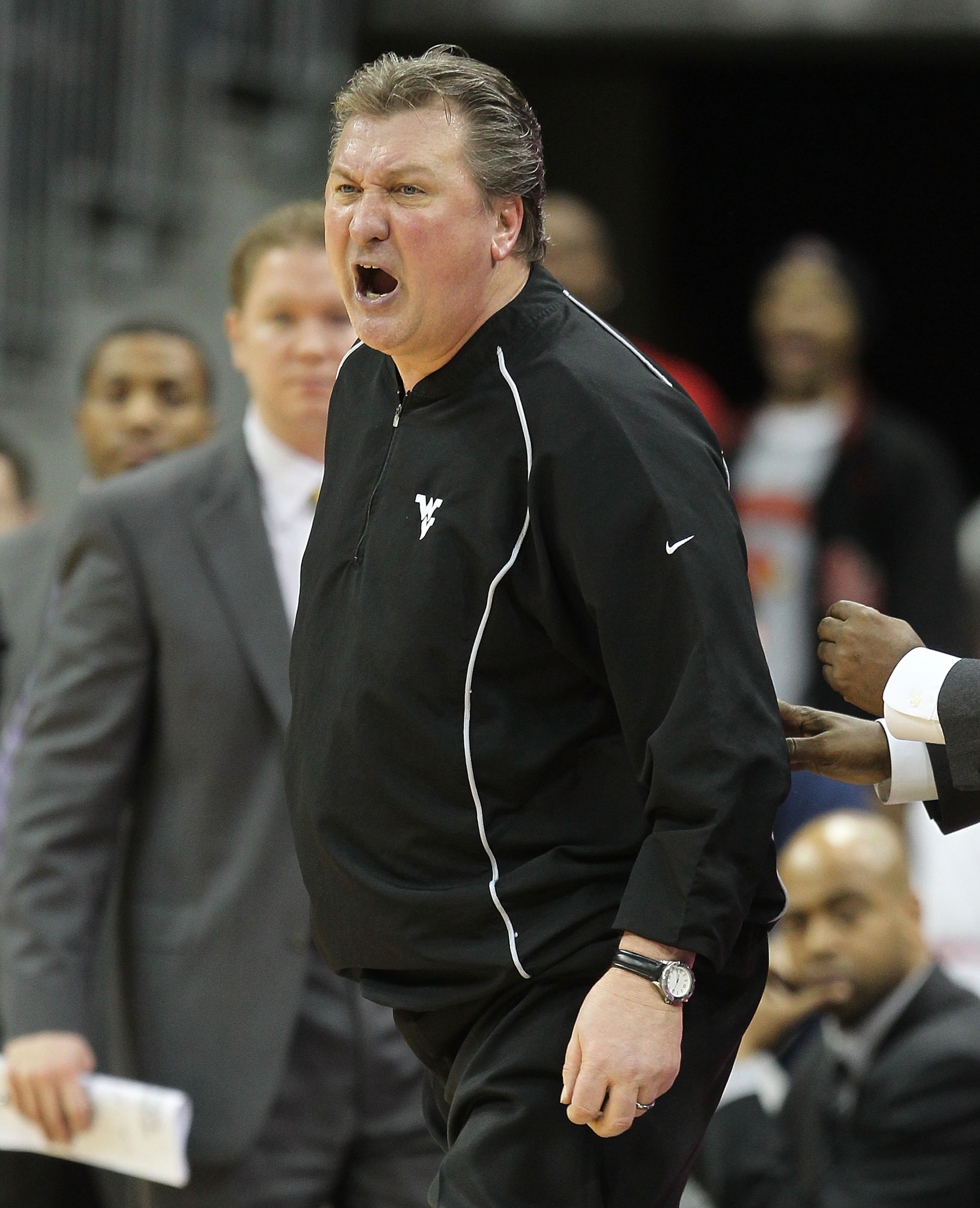 LOUISVILLE, KY - JANUARY 26:  Bob Huggins the Head Coach of the West Virginia Mountaineers screams at a game offical after earning a techical foul during the Big East Conference game against the Louisville Cardinals at the KFC Yum! Center on January 26, 2