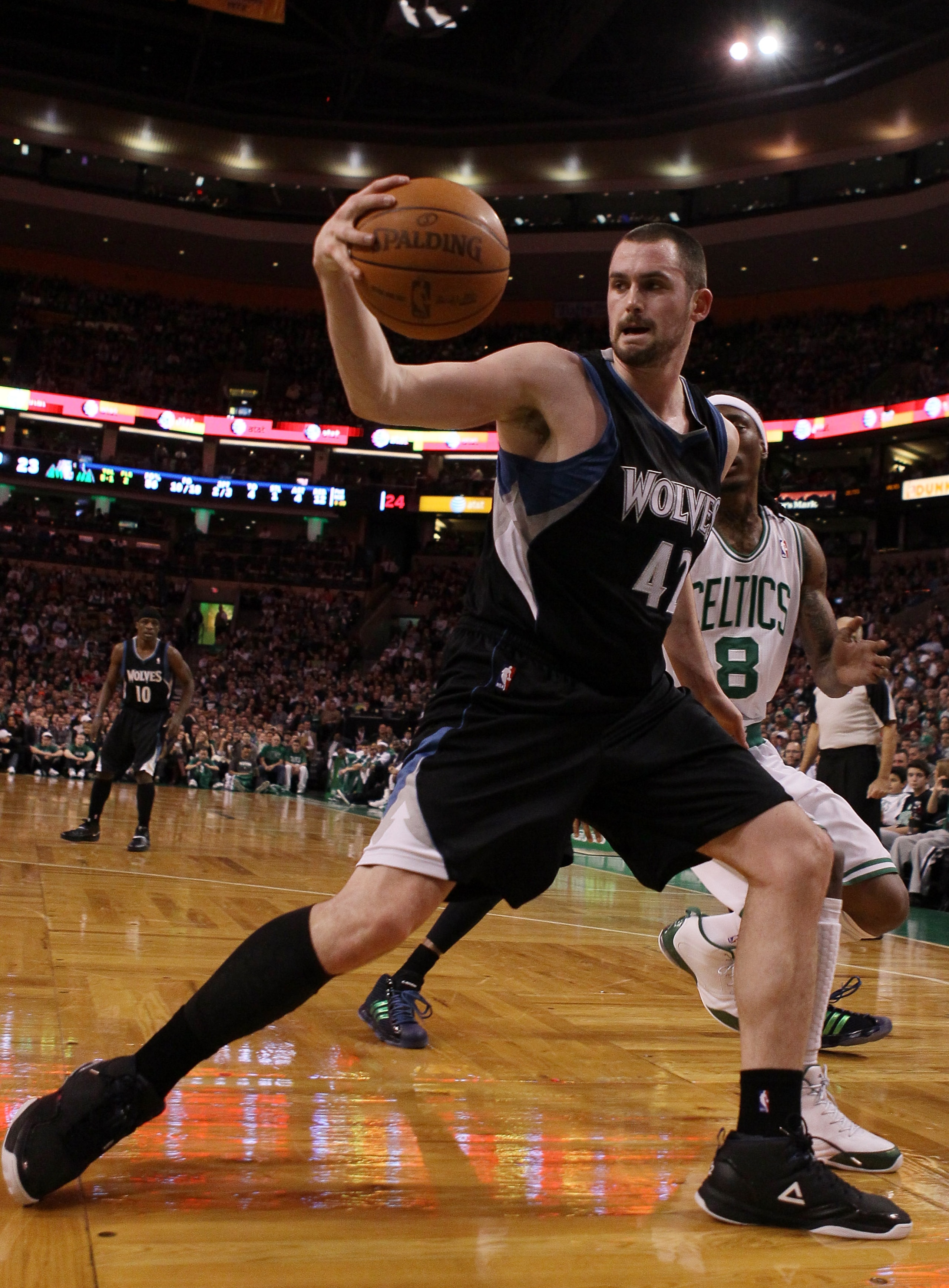 BOSTON, MA - JANUARY 03: Kevin Love #42 of the Minnesota Timberwolves grabs the loose ball as Marquis Daniels #8 of the Boston Celtics defends on January 3, 2011 at the TD Garden in Boston, Massachusetts. NOTE TO USER: User expressly acknowledges and agr BOSTON, MA - JANUARY 03: Kevin Love #42 of the Minnesota Timberwolves grabs the loose ball as Marquis Daniels #8 of the Boston Celtics defends on January 3, 2011 at the TD Garden in Boston, Massachusetts. NOTE TO USER: User expressly acknowledges and agr