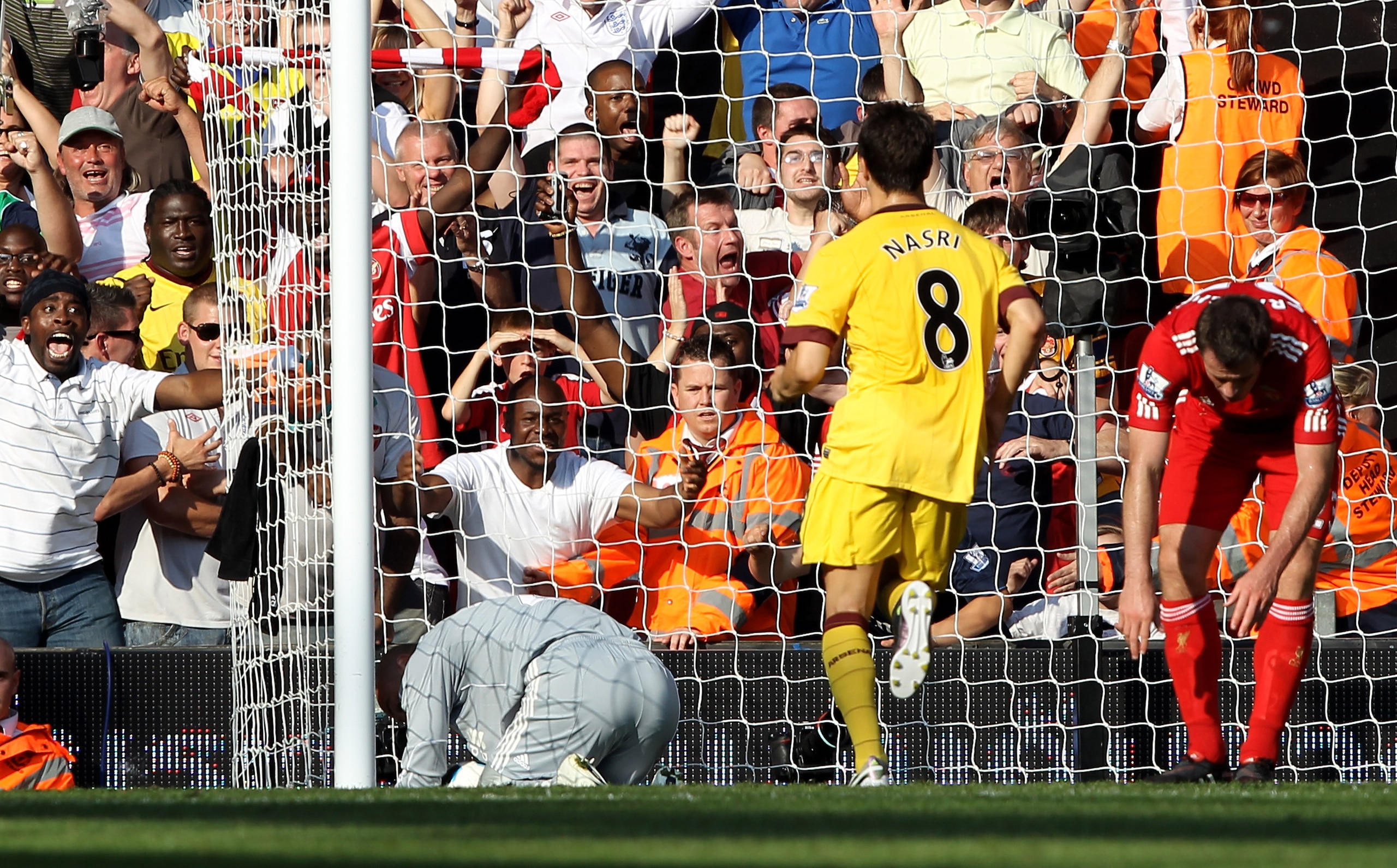 LIVERPOOL, ENGLAND - AUGUST 15:  Pepe Reina of Liverpool scores an own goal during the Barclays Premier League match between Liverpool and Arsenal at Anfield on August 15, 2010 in Liverpool, England.  (Photo by Clive Brunskill/Getty Images)
