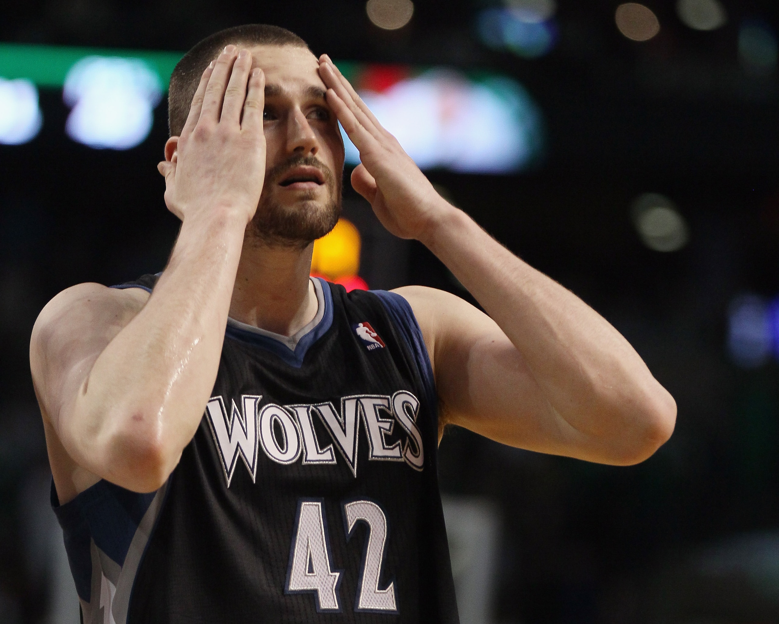 BOSTON, MA - JANUARY 03: Kevin Love #42 of the Minnesota Timberwolves wipes his face in the fourth quarter against the Boston Celtics on January 3, 2011 at the TD Garden in Boston, Massachusetts. The Celtics defeated the Timberwolves 96-93. NOTE TO USER: BOSTON, MA - JANUARY 03: Kevin Love #42 of the Minnesota Timberwolves wipes his face in the fourth quarter against the Boston Celtics on January 3, 2011 at the TD Garden in Boston, Massachusetts. The Celtics defeated the Timberwolves 96-93. NOTE TO USER: