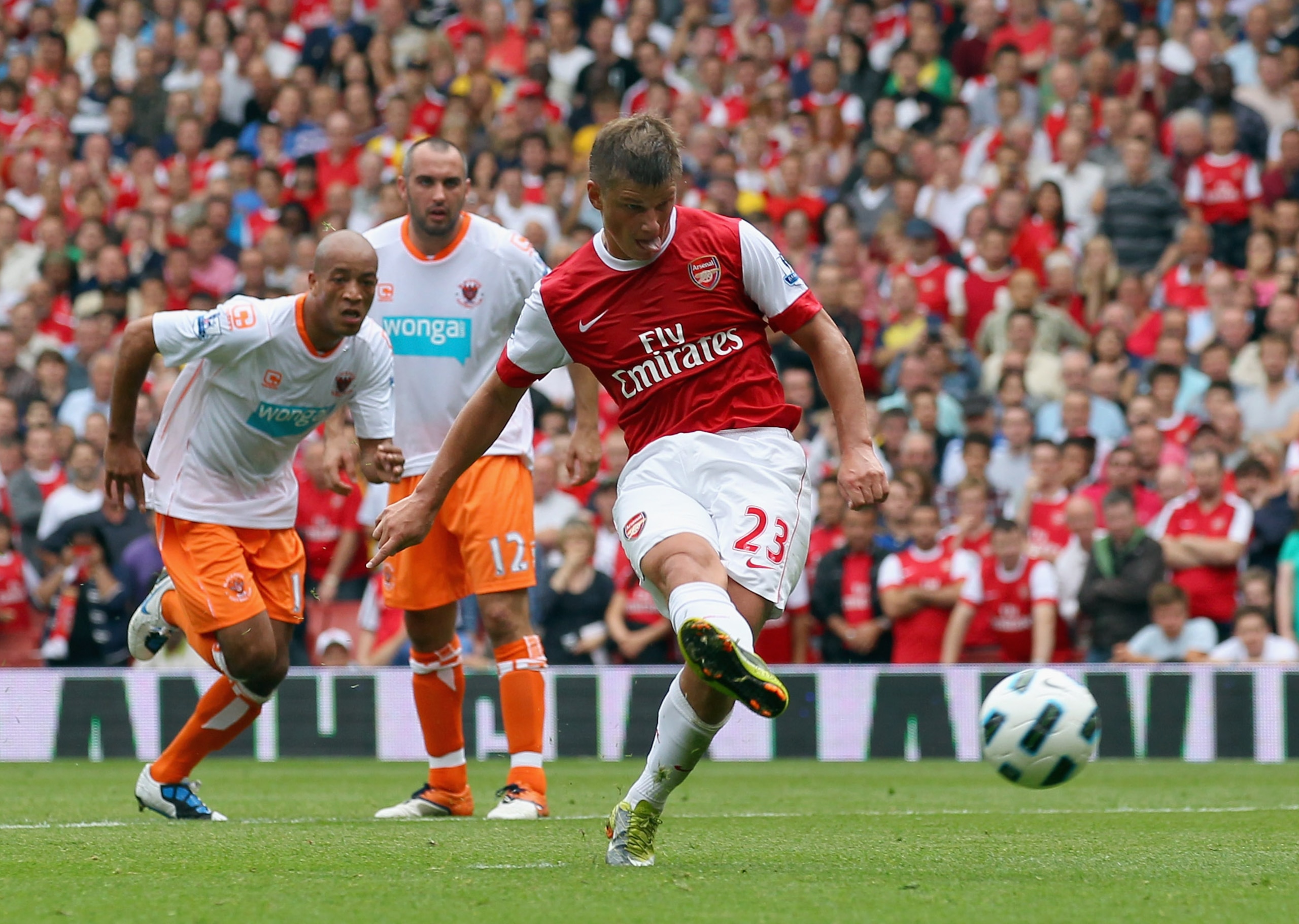 LONDON, ENGLAND - AUGUST 21: Andrey Arshavin of Arsenal scores a penalty during the Barclays Premier League match between Arsenal and Blackpool at The Emirates Stadium on August 21, 2010 in London, England.  (Photo by Clive Rose/Getty Images)