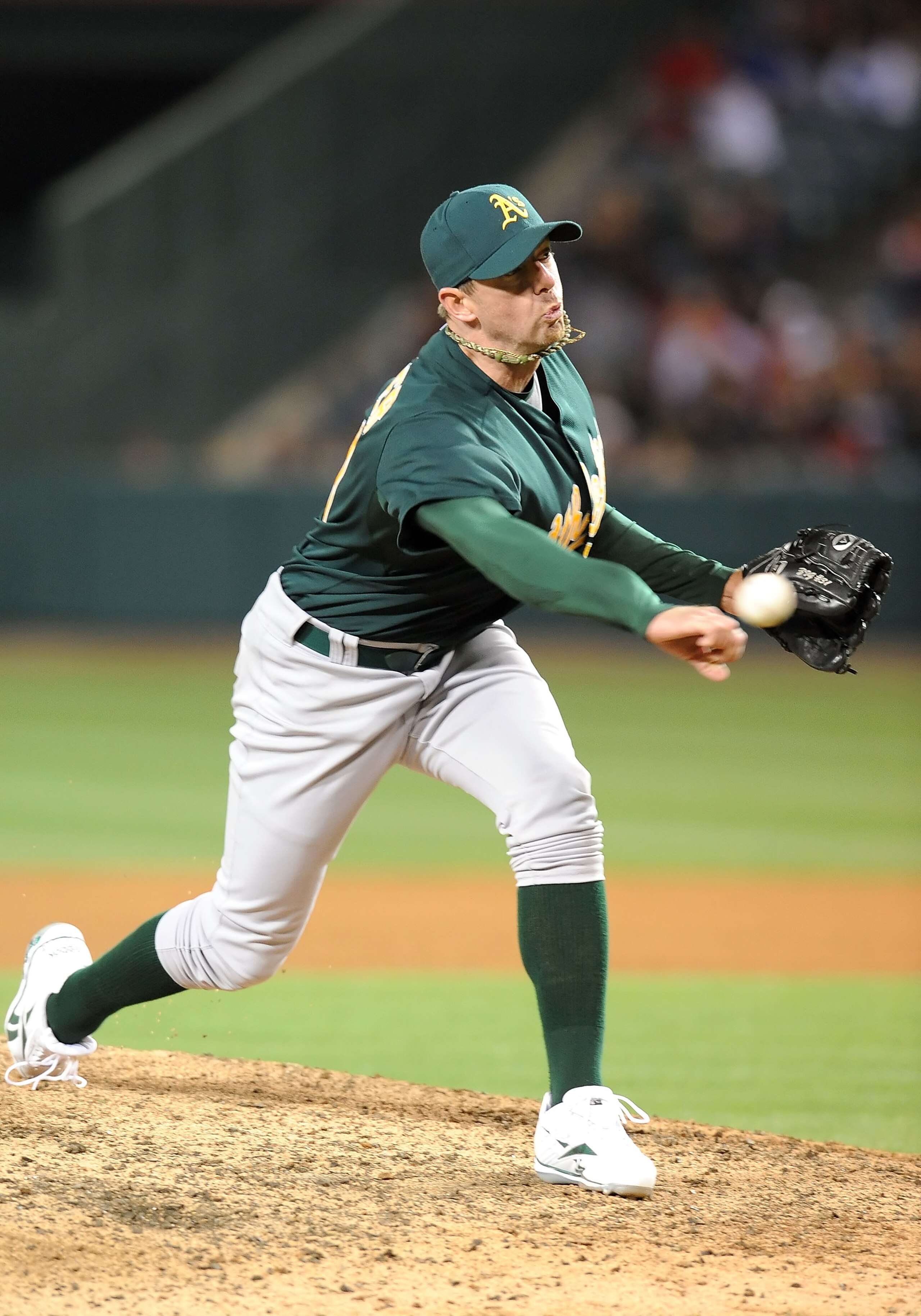 ANAHEIM, CA - APRIL 10: Brad Ziegler #31 of the Oakland Athletics pitches against the Los Angeles Angels of Anaheim on April 10, 2010 in Anaheim, California.  (Photo by Lisa Blumenfeld/Getty Images)