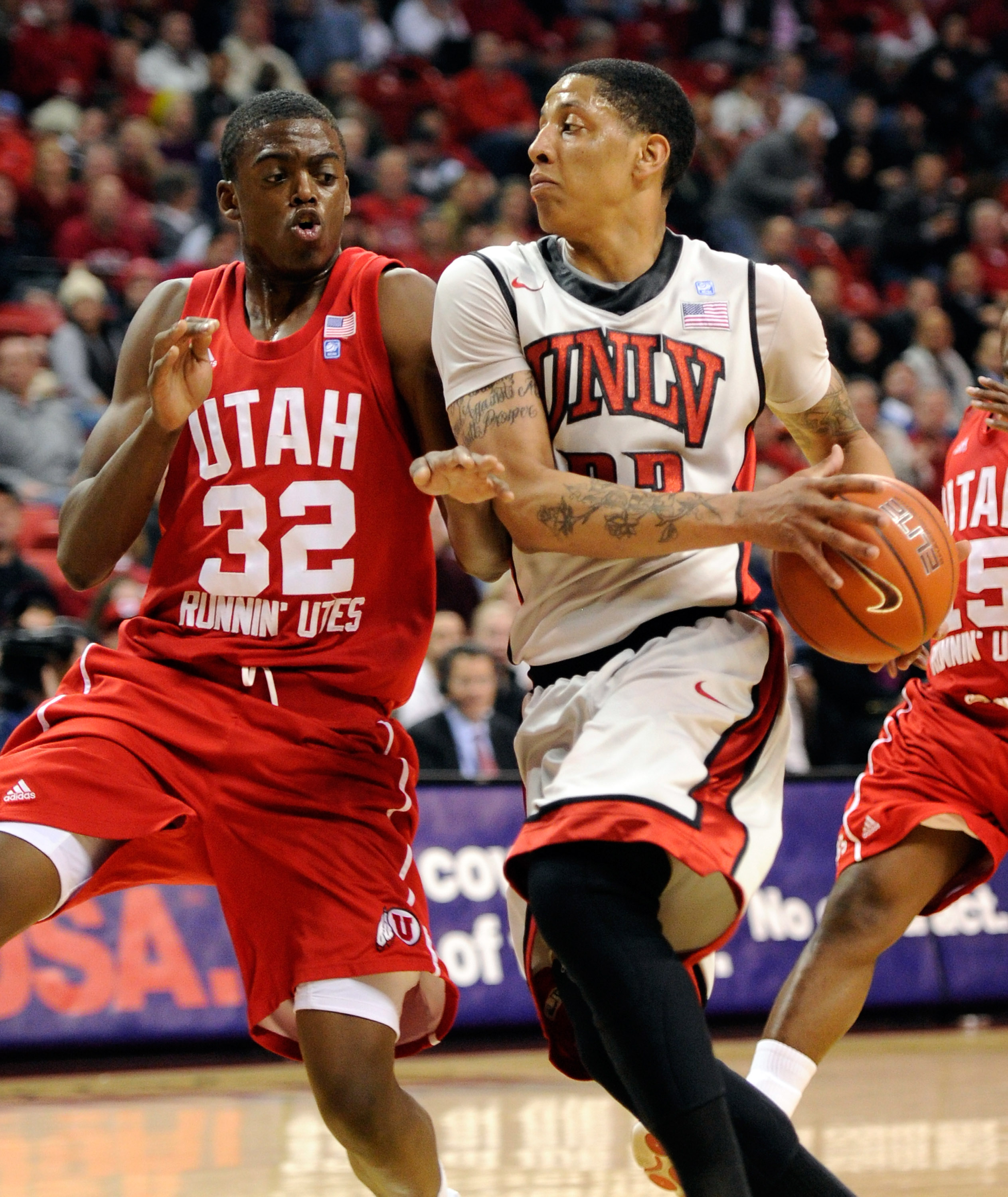 LAS VEGAS, NV - FEBRUARY 02:  Tre'Von Willis #33 of the UNLV Rebels drives against Shawn Glover #32 of the Utah Utes during their game at the Thomas & Mack Center February 2, 2011 in Las Vegas, Nevada. UNLV won 67-54.  (Photo by Ethan Miller/Getty Images)