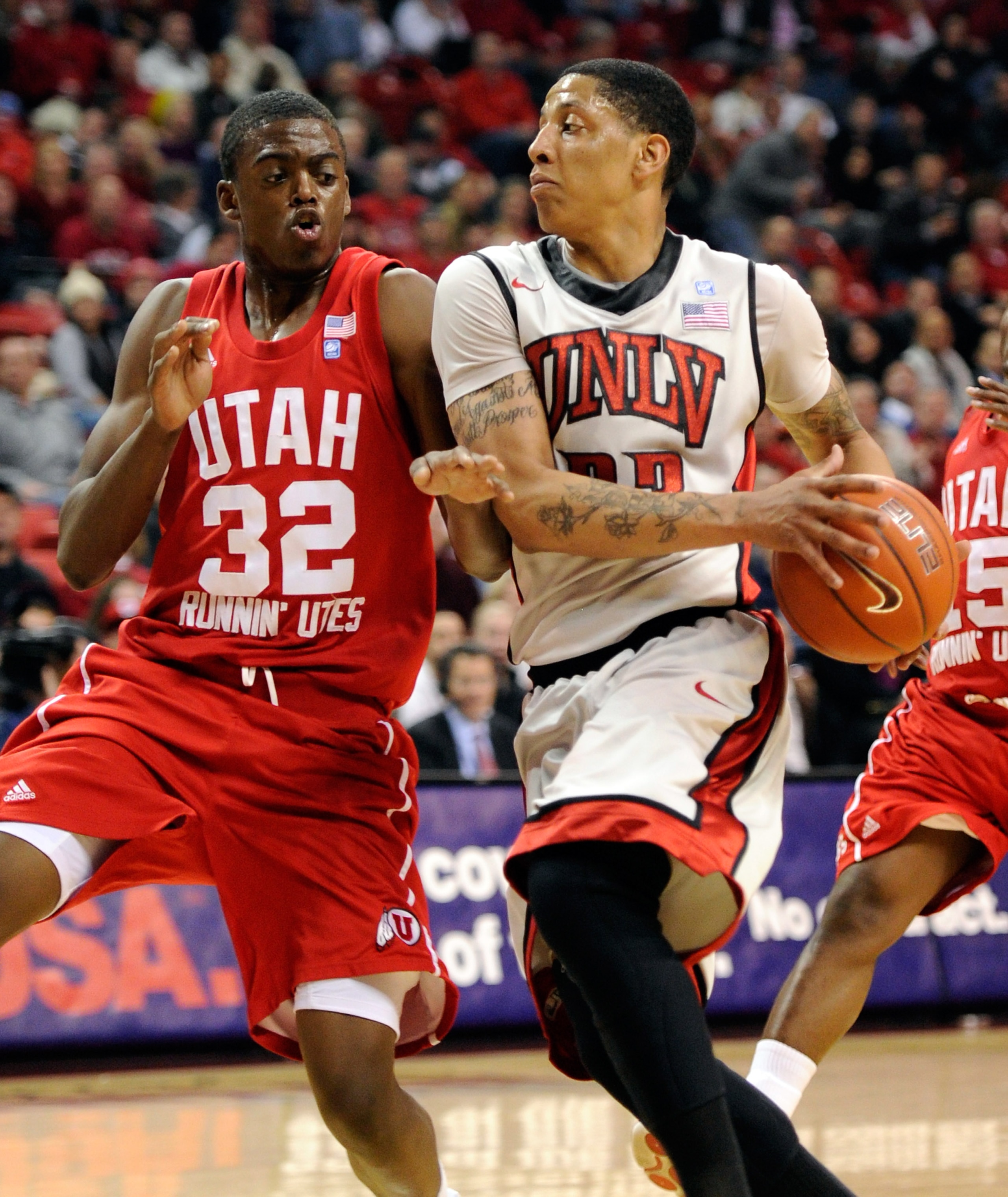 LAS VEGAS, NV - FEBRUARY 02:  Tre'Von Willis #33 of the UNLV Rebels drives against Shawn Glover #32 of the Utah Utes during their game at the Thomas & Mack Center February 2, 2011 in Las Vegas, Nevada. UNLV won 67-54.  (Photo by Ethan Miller/Getty Images)