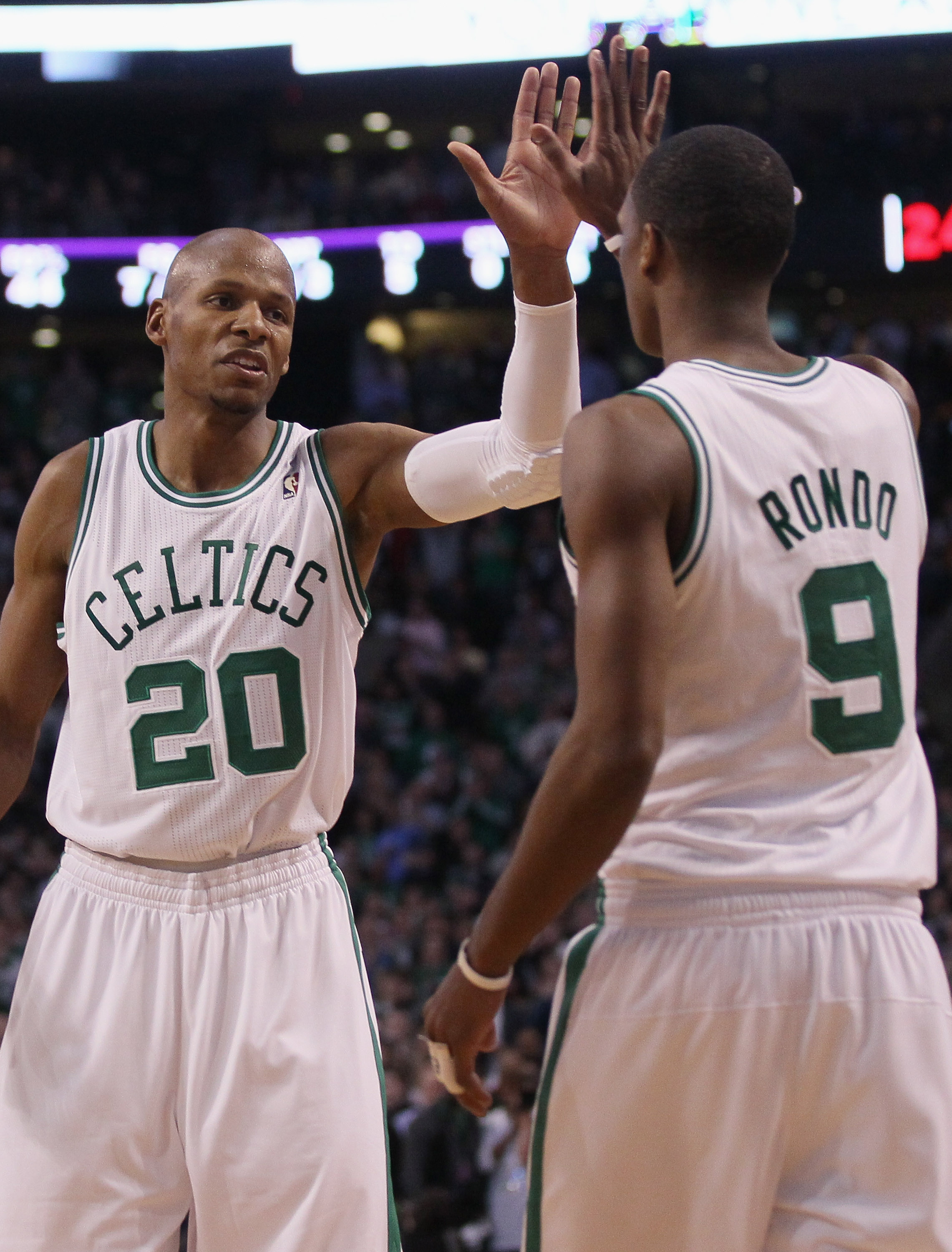BOSTON, MA - FEBRUARY 10:  Ray Allen #20 of the Boston Celtics celebrates with Rajon Rondo #9 in the first half against the Los Angeles Lakers on February 10, 2011 at the TD Garden in Boston, Massachusetts.  NOTE TO USER: User expressly acknowledges and a