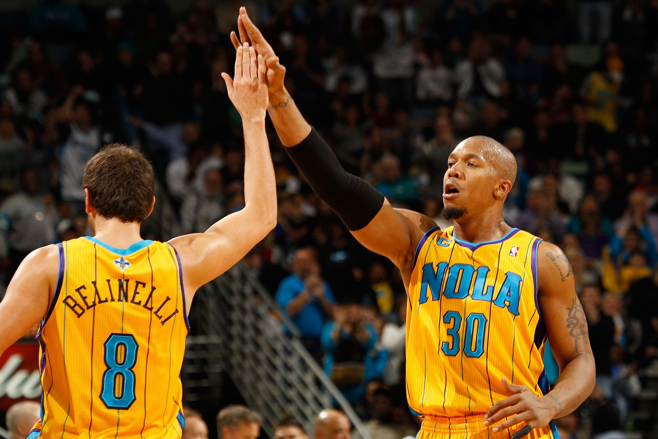 NEW ORLEANS, LA - JANUARY 22: David West #30 and Marco Belinelli #8 of the New Orleans Hornets celebrate during the game against the San Antonio Spurs at the New Orleans Arena on January 22, 2011 in New Orleans, Louisiana. The Hornets defeated the Spurs NEW ORLEANS, LA - JANUARY 22: David West #30 and Marco Belinelli #8 of the New Orleans Hornets celebrate during the game against the San Antonio Spurs at the New Orleans Arena on January 22, 2011 in New Orleans, Louisiana. The Hornets defeated the Spurs
