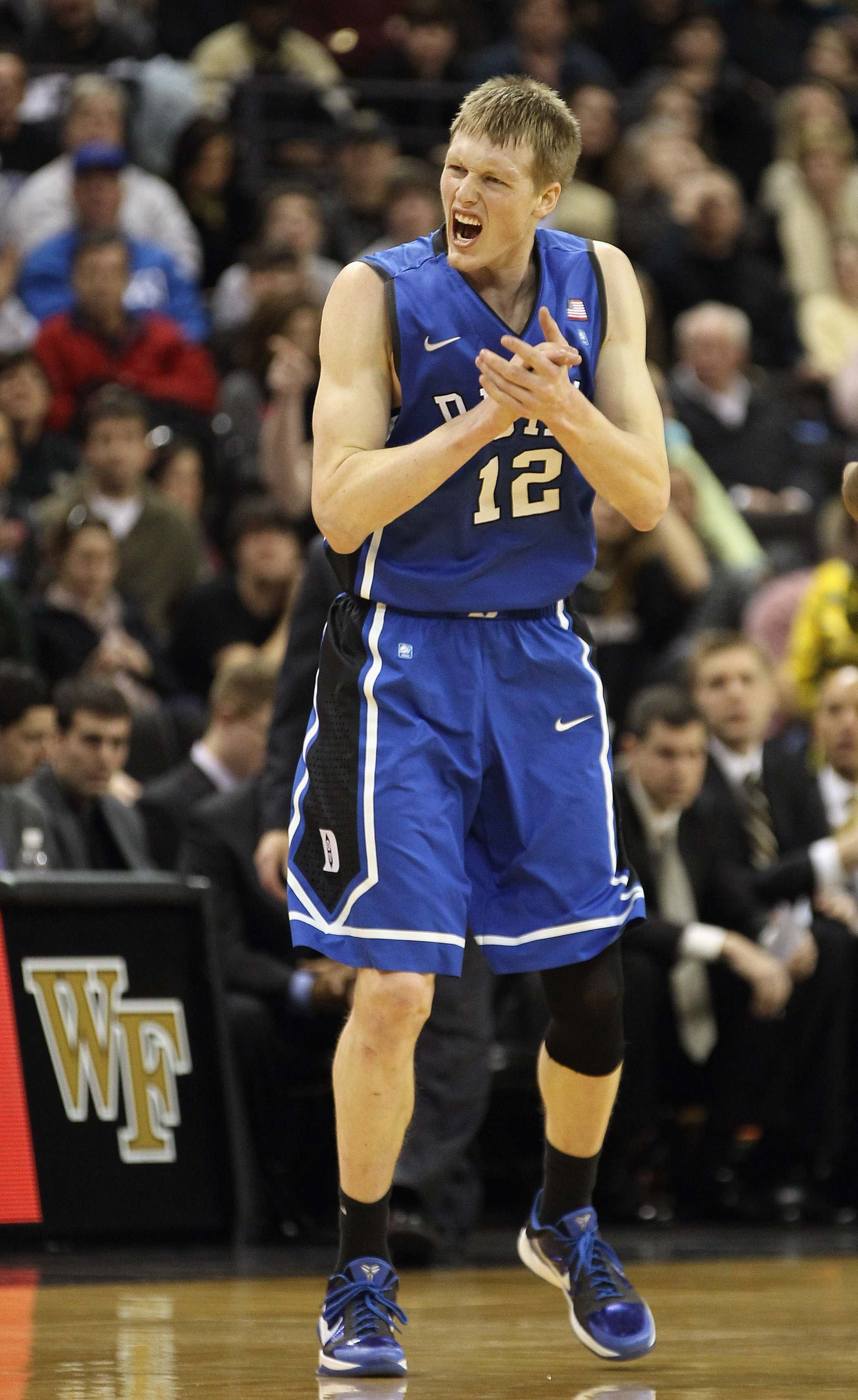 WINSTON SALEM, NC - JANUARY 22:  Kyle Singler #12 of the Duke Blue Devils reacts to a play during their game against the Wake Forest Demon Deacons at Lawrence Joel Coliseum on January 22, 2011 in Winston Salem, North Carolina.  (Photo by Streeter Lecka/Ge