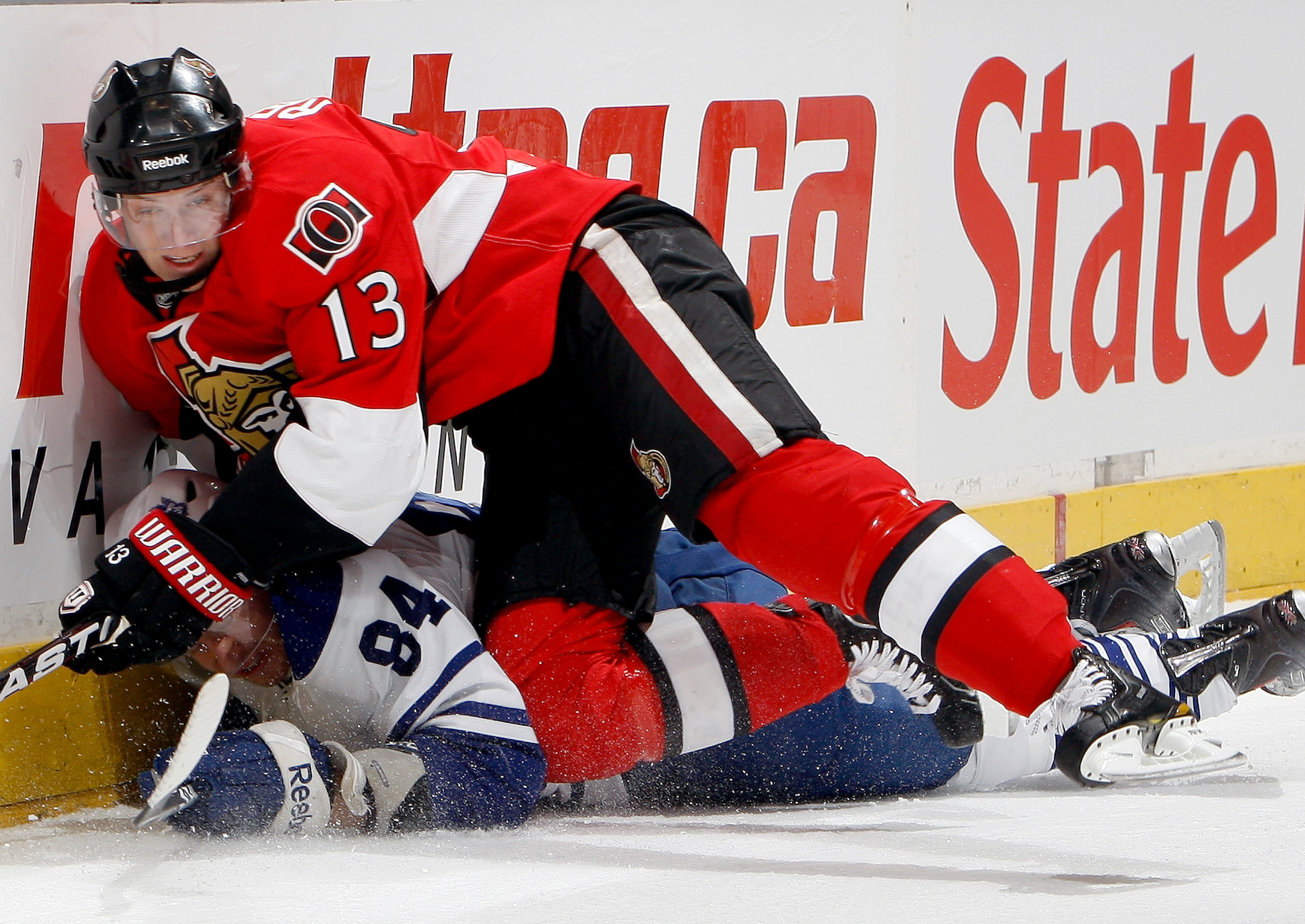 TORONTO, CANADA - FEBRUARY 19: Mikhail Grabovski #84 of the Toronto Maple Leafs gets hit by Peter Regin #13 of the Ottawa Senators at the Air Canada Centre February 19, 2011 in Toronto, Ontario, Canada. (Photo by Abelimages/Getty Images) TORONTO, CANADA - FEBRUARY 19: Mikhail Grabovski #84 of the Toronto Maple Leafs gets hit by Peter Regin #13 of the Ottawa Senators at the Air Canada Centre February 19, 2011 in Toronto, Ontario, Canada. (Photo by Abelimages/Getty Images)