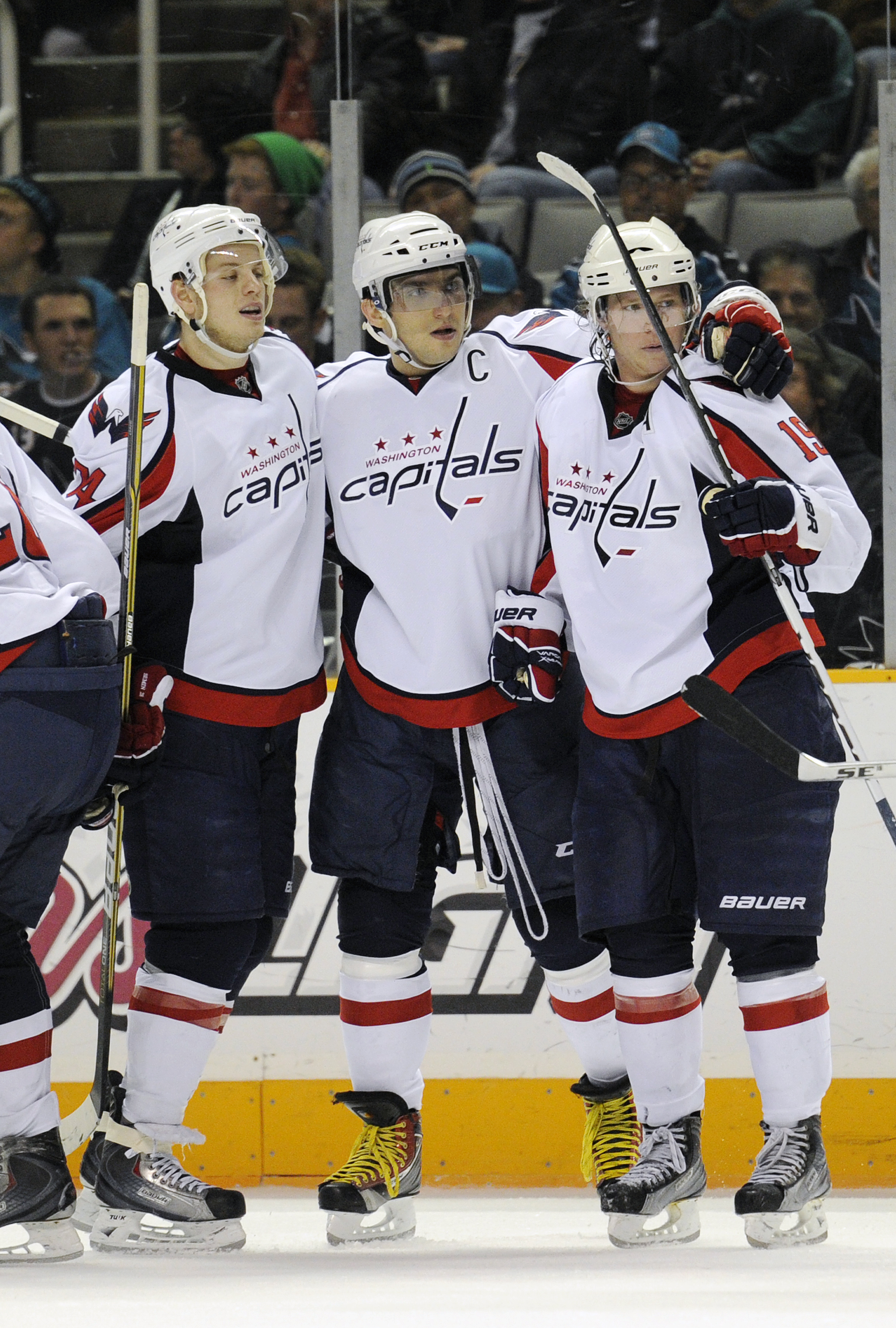 SAN JOSE, CA - FEBRUARY 17: Nicklas Backstrom #19 of the Washington Capitals celebrates with teammates John Carlson #74 and Alex Ovechkin #8 after scoring a goal against the San Jose Sharks in the third period during an NHL hockey game at the HP Pavilion