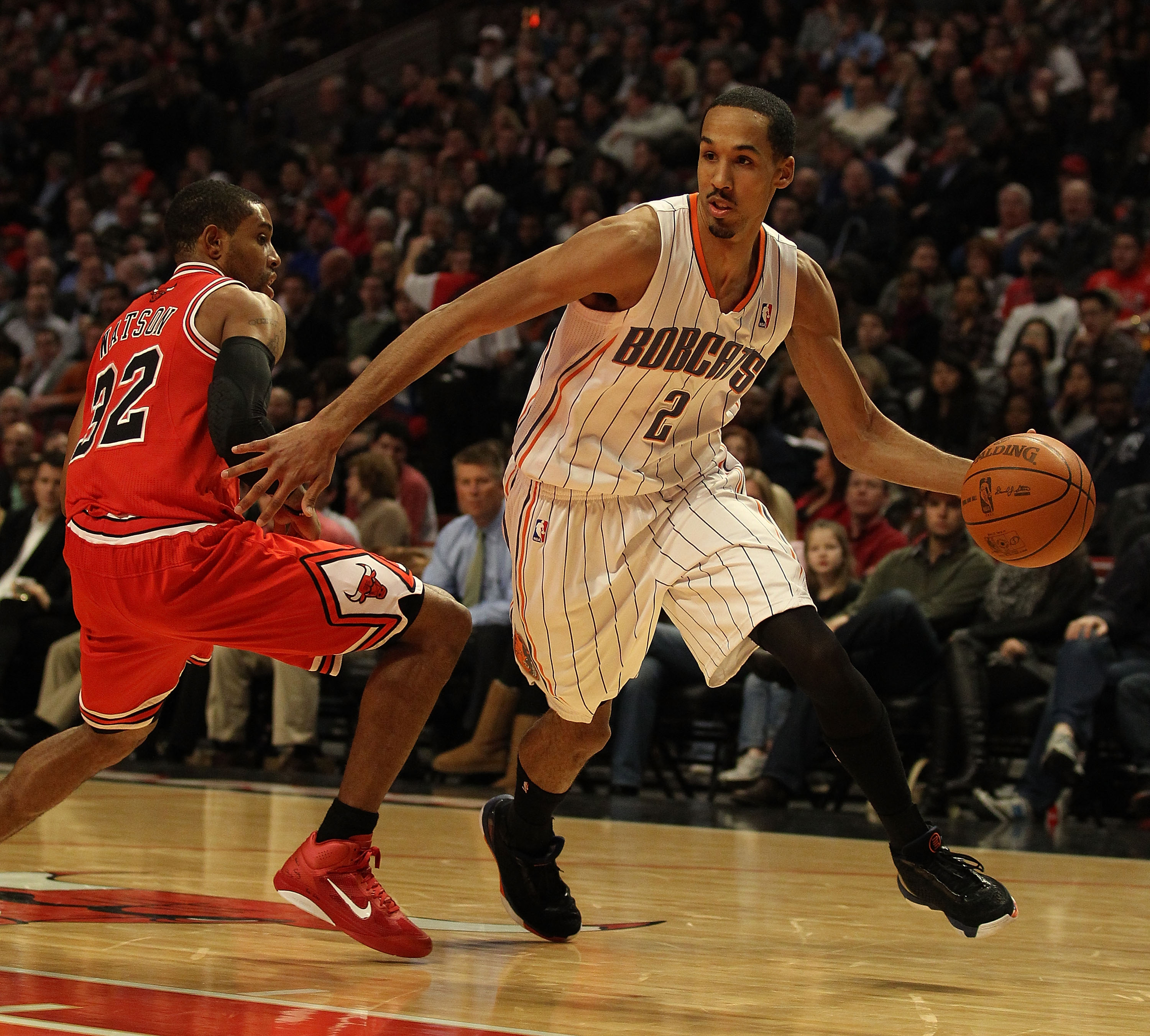 CHICAGO, IL - FEBRUARY 15: Shaun Livingston #2 of the Charlotte Bobcats moves around C.J. Watson #32 of the Chicago Bulls at the United Center on February 15, 2011 in Chicago, Illinois. The Bulls defeated the Bobcats 106-94. NOTE TO USER: User expressly a