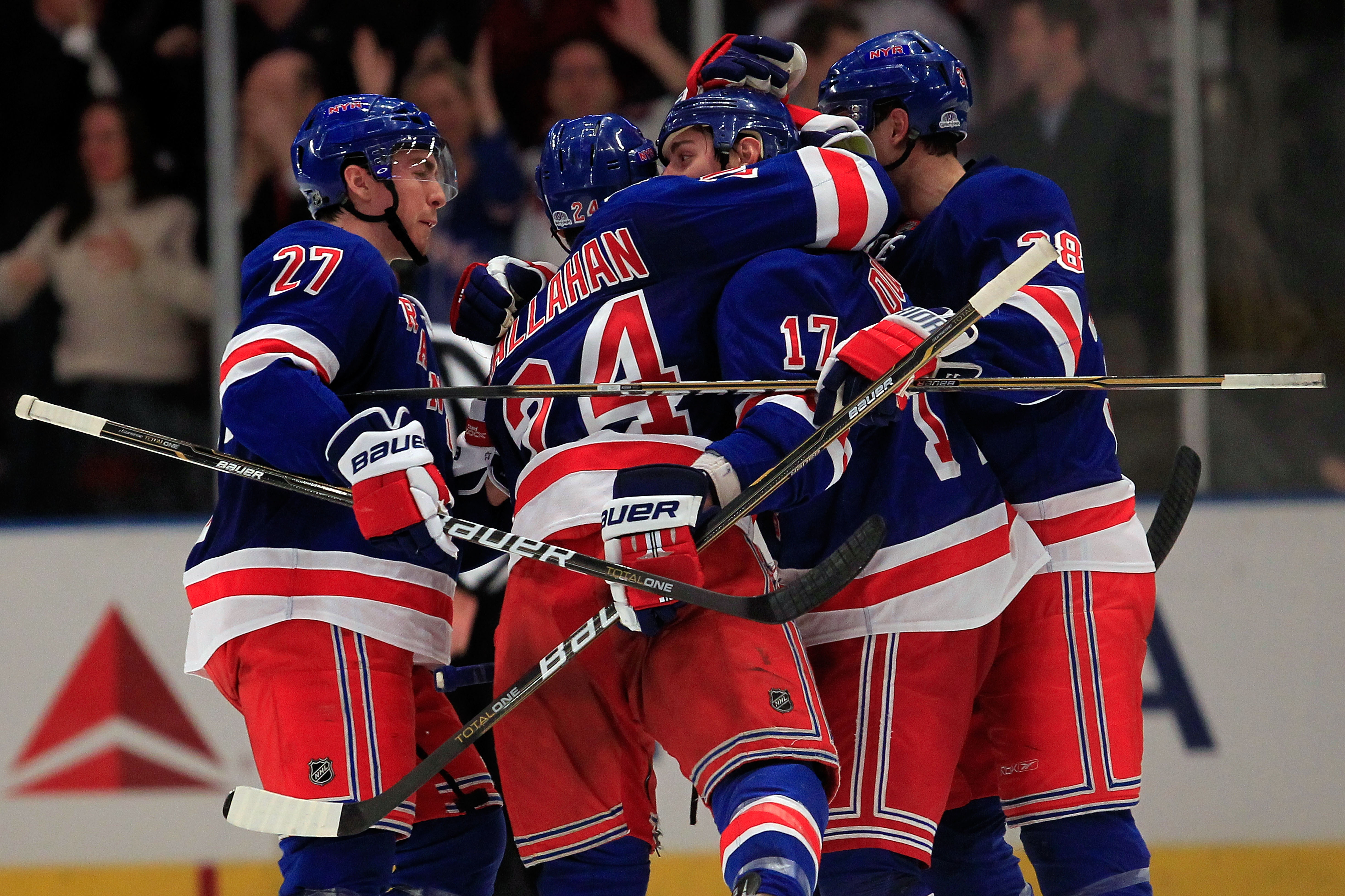 NEW YORK, NY - FEBRUARY 17: Brandon Dubinsky #17 of the New York Rangers is congratulated by his teammates for his goal in the third period against the Los Angeles Kings on February 17, 2011 in New York City. The Rangers defeated the Kings 4-3 after a sh