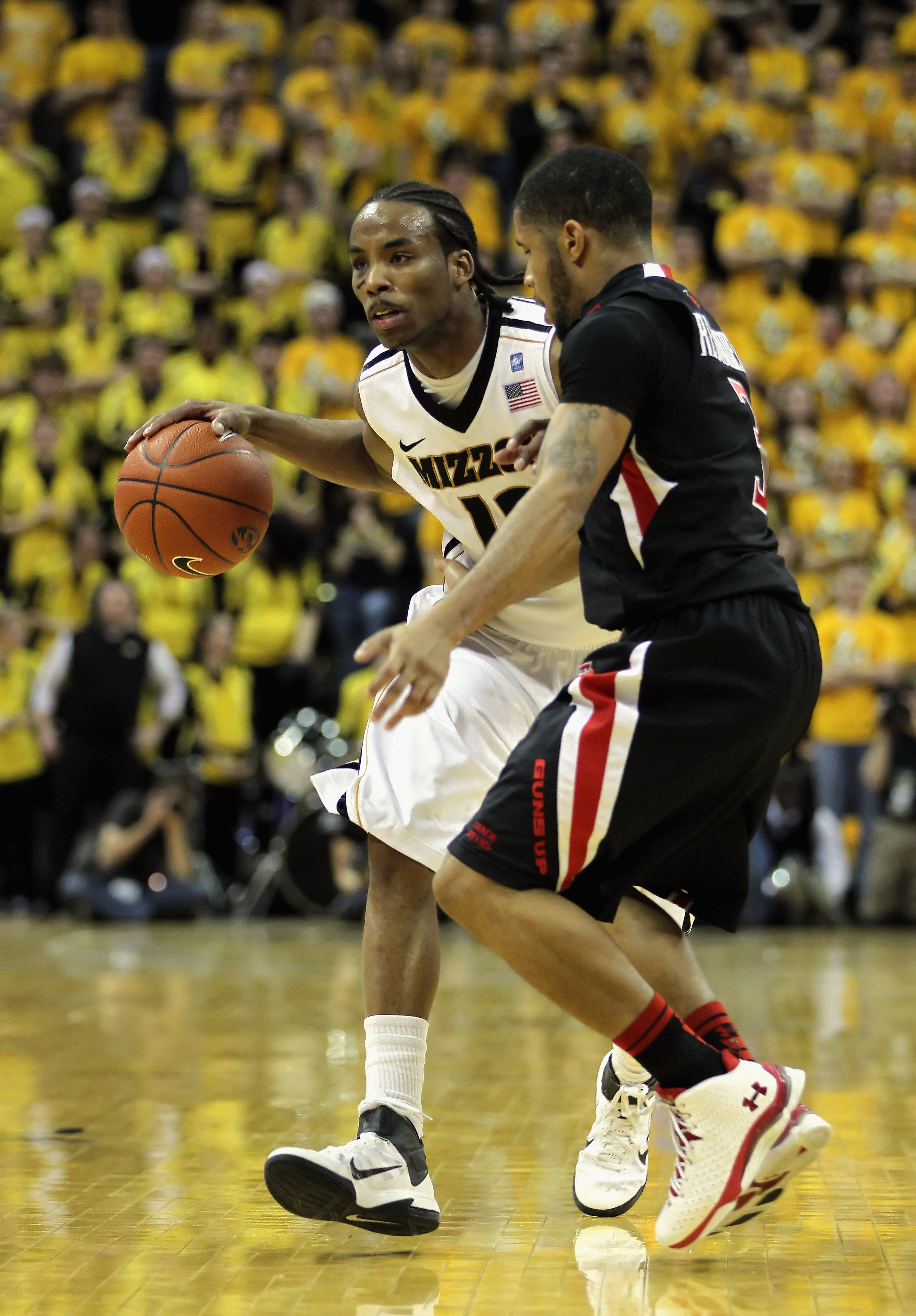 COLUMBIA, MO - FEBRUARY 15:  Marcus Denmon #12 of the Missouri Tigers controls the ball as Javarez Willis #3 of the Texas Tech Red Raiders defend during the game on February 15, 2011 at Mizzou Arena in Columbia, Missouri.  (Photo by Jamie Squire/Getty Ima