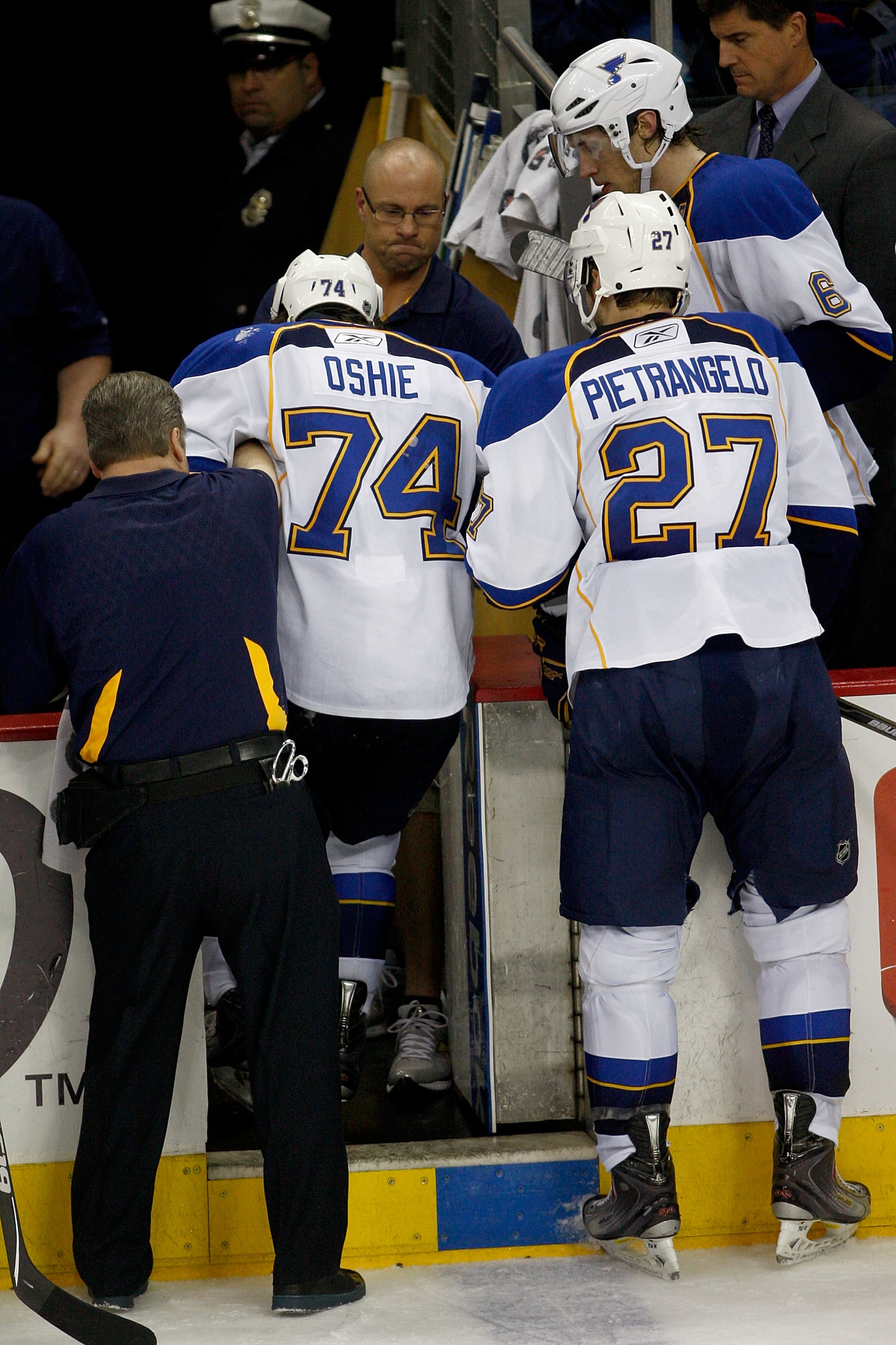 COLUMBUS,OH - NOVEMBER 10:  Alex Pietrangelo #27 of the St. Louis Blues helps teammate T.J. Oshie #74 of the St. Louis Blues leave the ice after he was injured during the third period against the Columbus Blue Jackets on November 10, 2010 at Nationwide Ar
