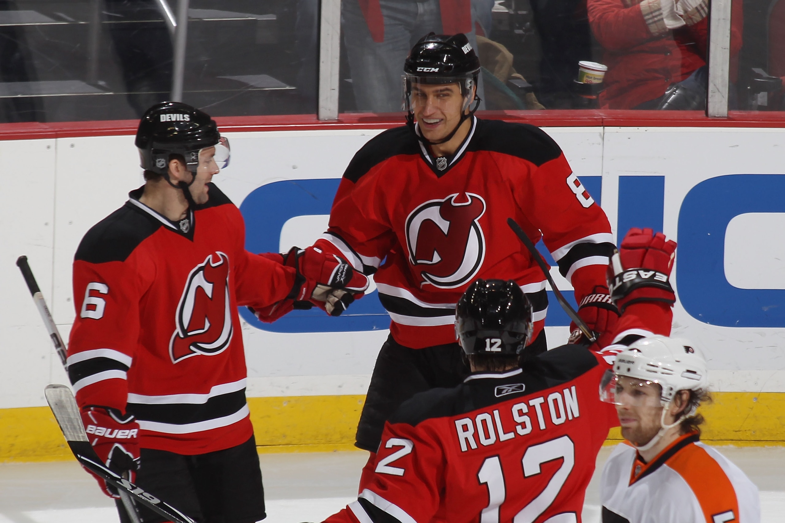 NEWARK, NJ - JANUARY 06: Andy Greene #6 congratulates Dainius Zubrus #8 of the New Jersey Devils on his first period goal against the Philadelphia Flyers at the Prudential Center on January 6, 2011 in Newark, New Jersey.  (Photo by Bruce Bennett/Getty Ima