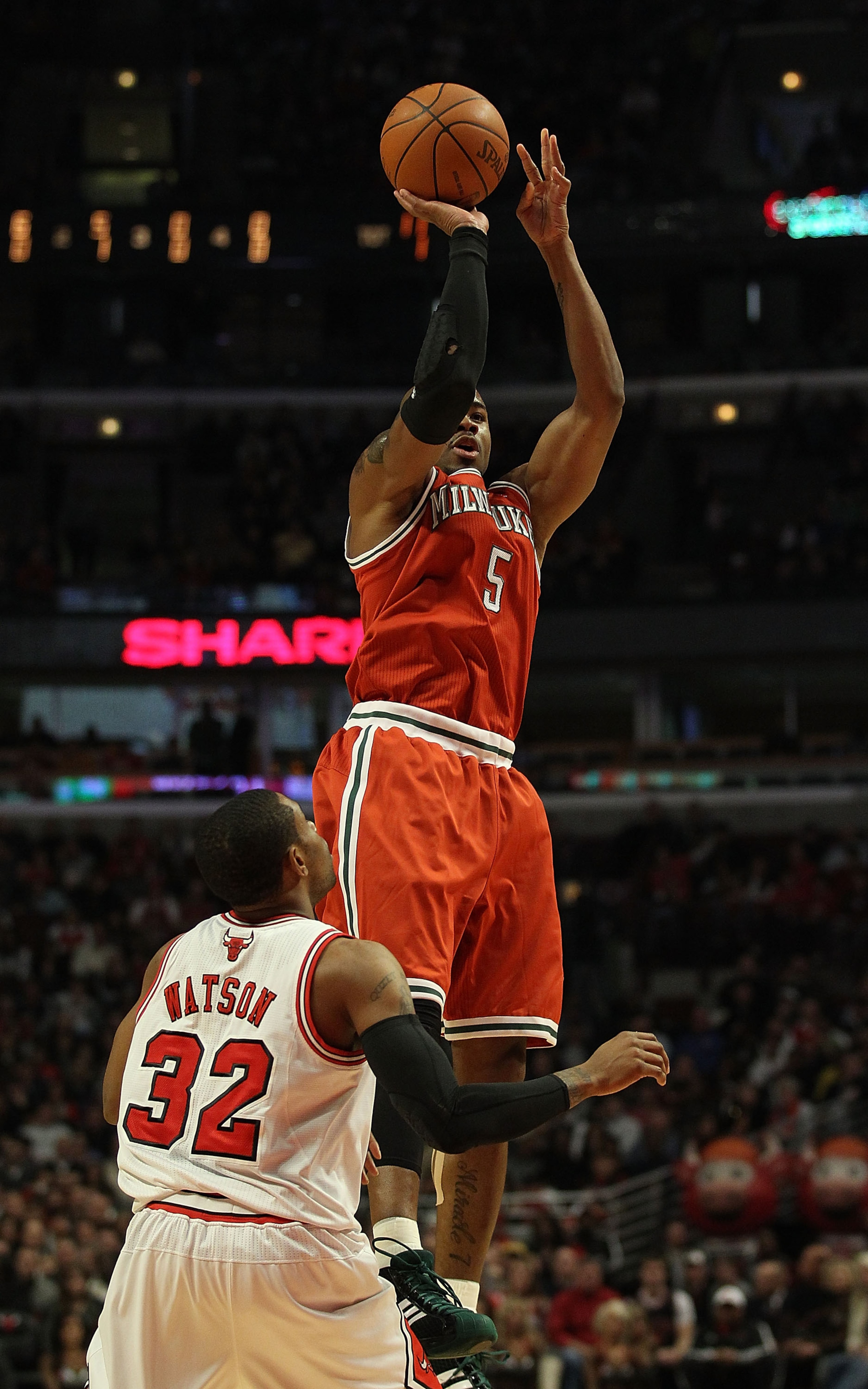 CHICAGO, IL - DECEMBER 28: Corey Maggette #5 of the Milwaukee Bucks puts up a shot over C.J. Watson #32 of the Chicago Bulls at the United Center on December 28, 2010 in Chicago, Illinois. The Bulls defeated the Bucks 90-77. NOTE TO USER: User expressly a