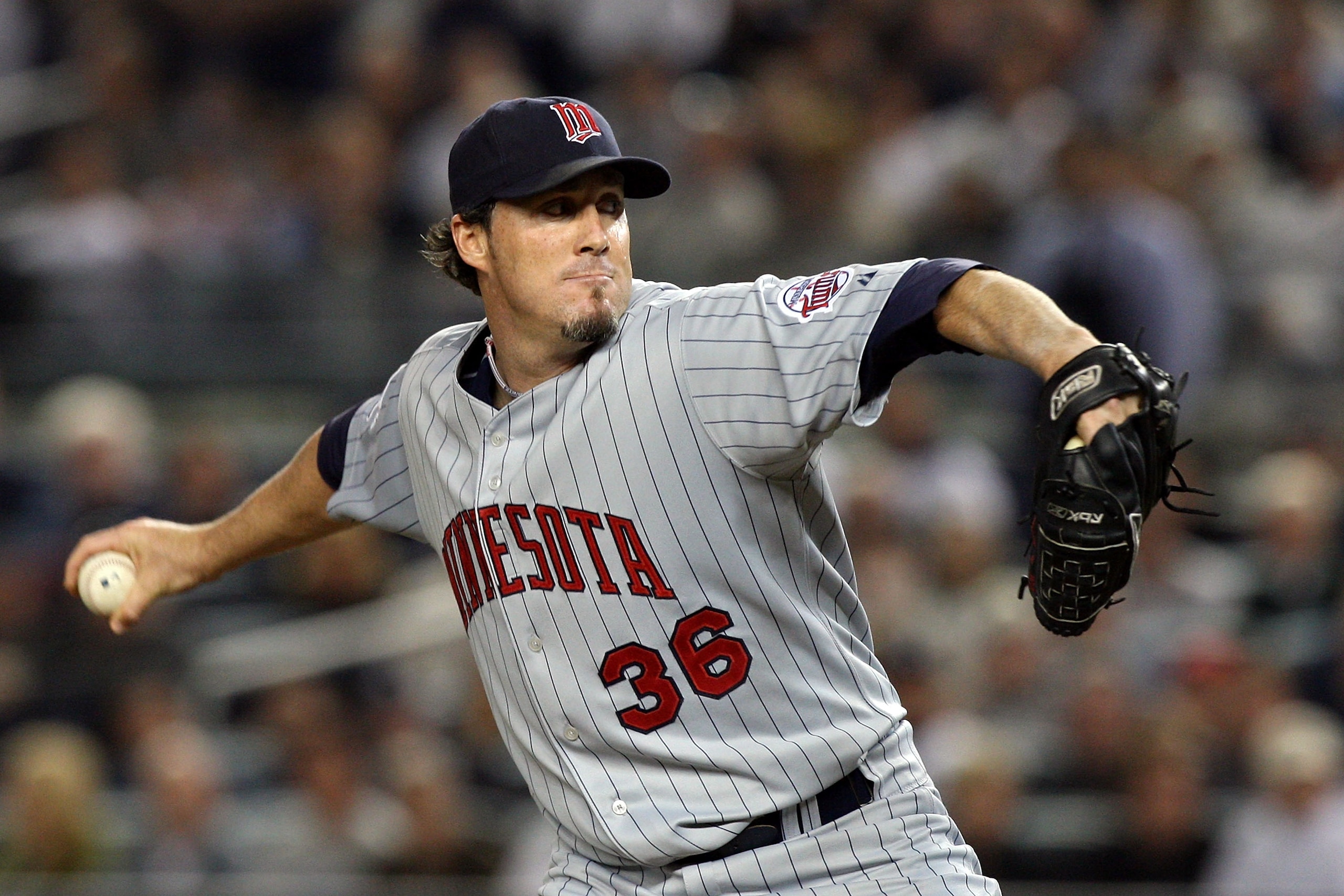 NEW YORK - OCTOBER 09:  Joe Nathan #36 of the Minnesota Twins pitches against the New York Yankees in Game Two of the ALDS during the 2009 MLB Playoffs at Yankee Stadium on October 9, 2009 in the Bronx borough of New York City.  (Photo by Jim McIsaac/Gett