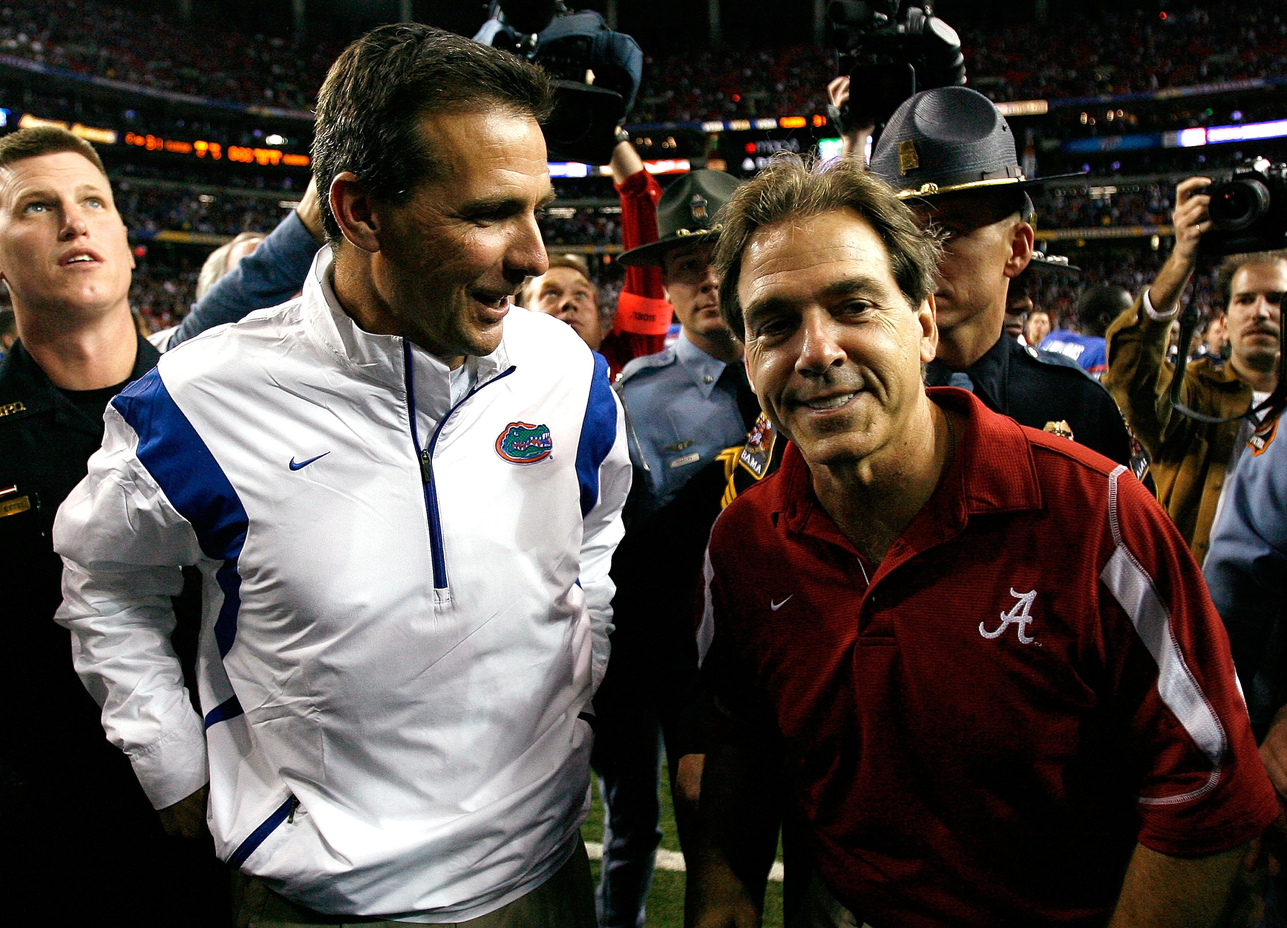ATLANTA - DECEMBER 06: Head coach Nick Saban of the Alabama Crimson Tide congratulates head coach Urban Meyer of the Florida Gators after the Gators 31-20 win in the SEC Championship on December 6, 2008 at the Georgia Dome in Atlanta, Georgia. (Photo by ATLANTA - DECEMBER 06: Head coach Nick Saban of the Alabama Crimson Tide congratulates head coach Urban Meyer of the Florida Gators after the Gators 31-20 win in the SEC Championship on December 6, 2008 at the Georgia Dome in Atlanta, Georgia. (Photo by