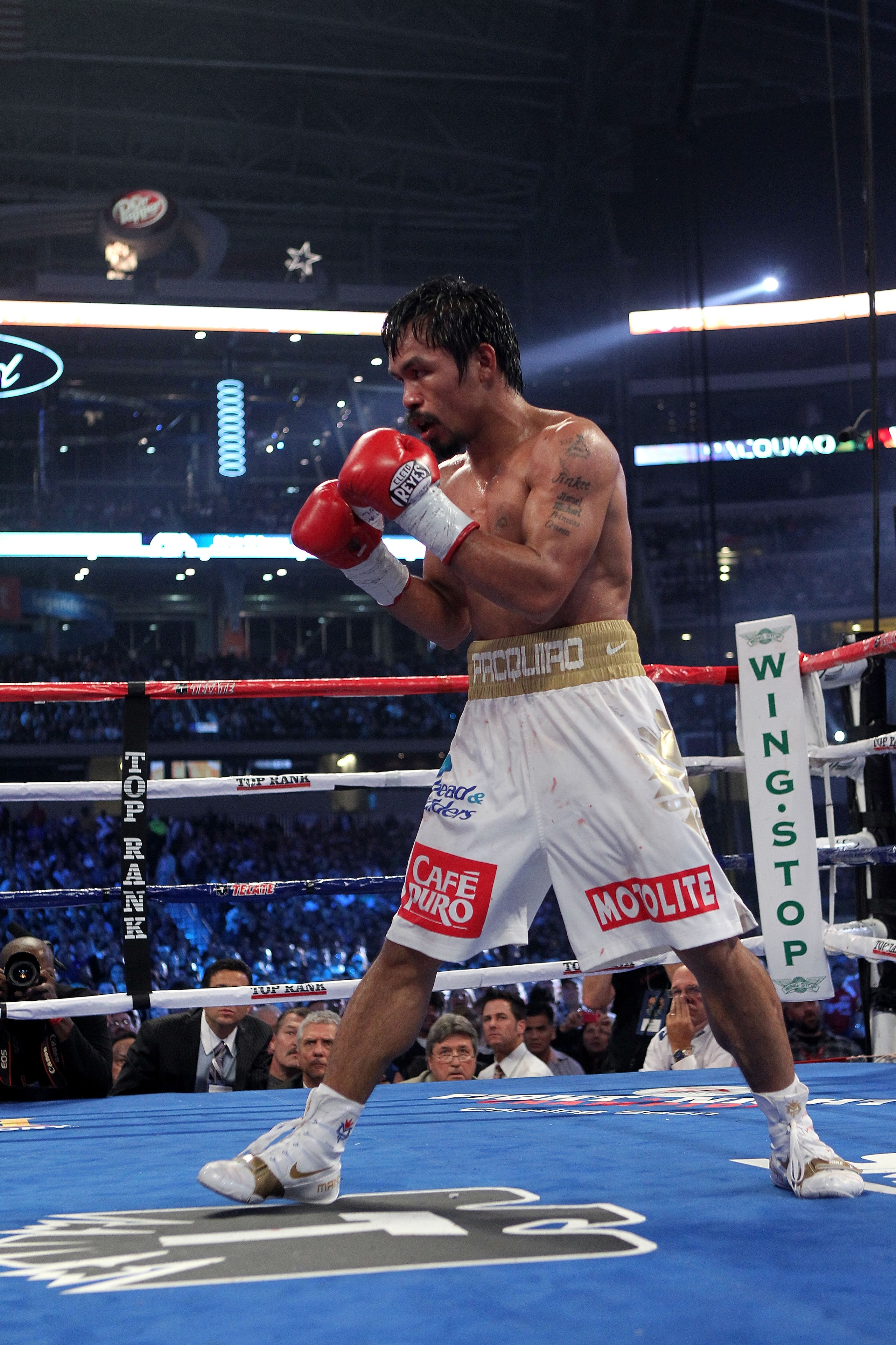 ARLINGTON, TX - NOVEMBER 13:  Manny Pacquiao (white trunks) of the Philippines fights against Antonio Margarito of Mexico during their WBC World Super Welterweight Title bout at Cowboys Stadium on November 13, 2010 in Arlington, Texas.  (Photo by Nick Lah