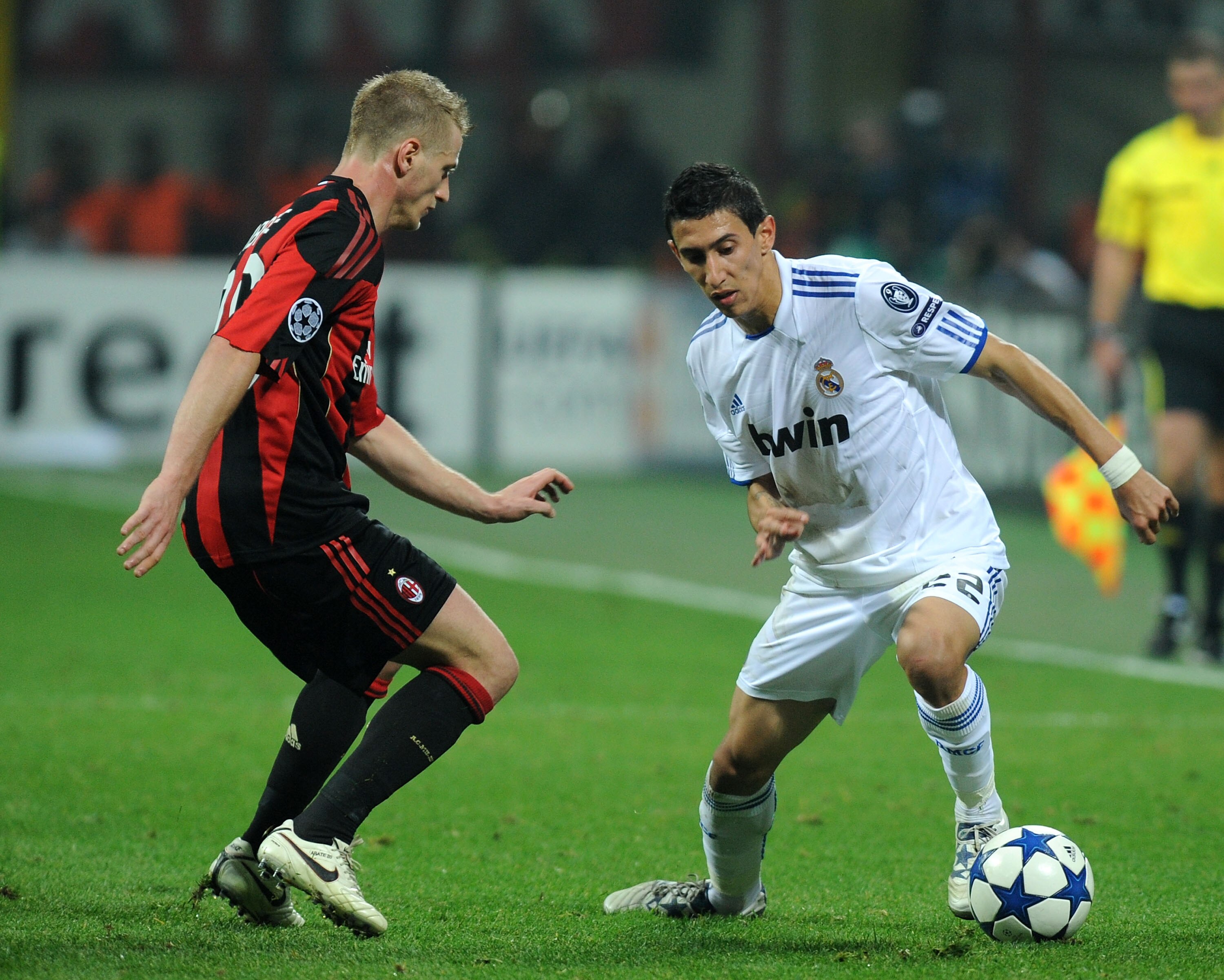 MILAN, ITALY - NOVEMBER 03: Ignazio Abate of AC Milan battles for the ball against Angel Di Maria of Real Madrid during the UEFA Champions League group G match between AC Milan and Real Madrid at Stadio Giuseppe Meazza on November 3, 2010 in Milan, Italy.