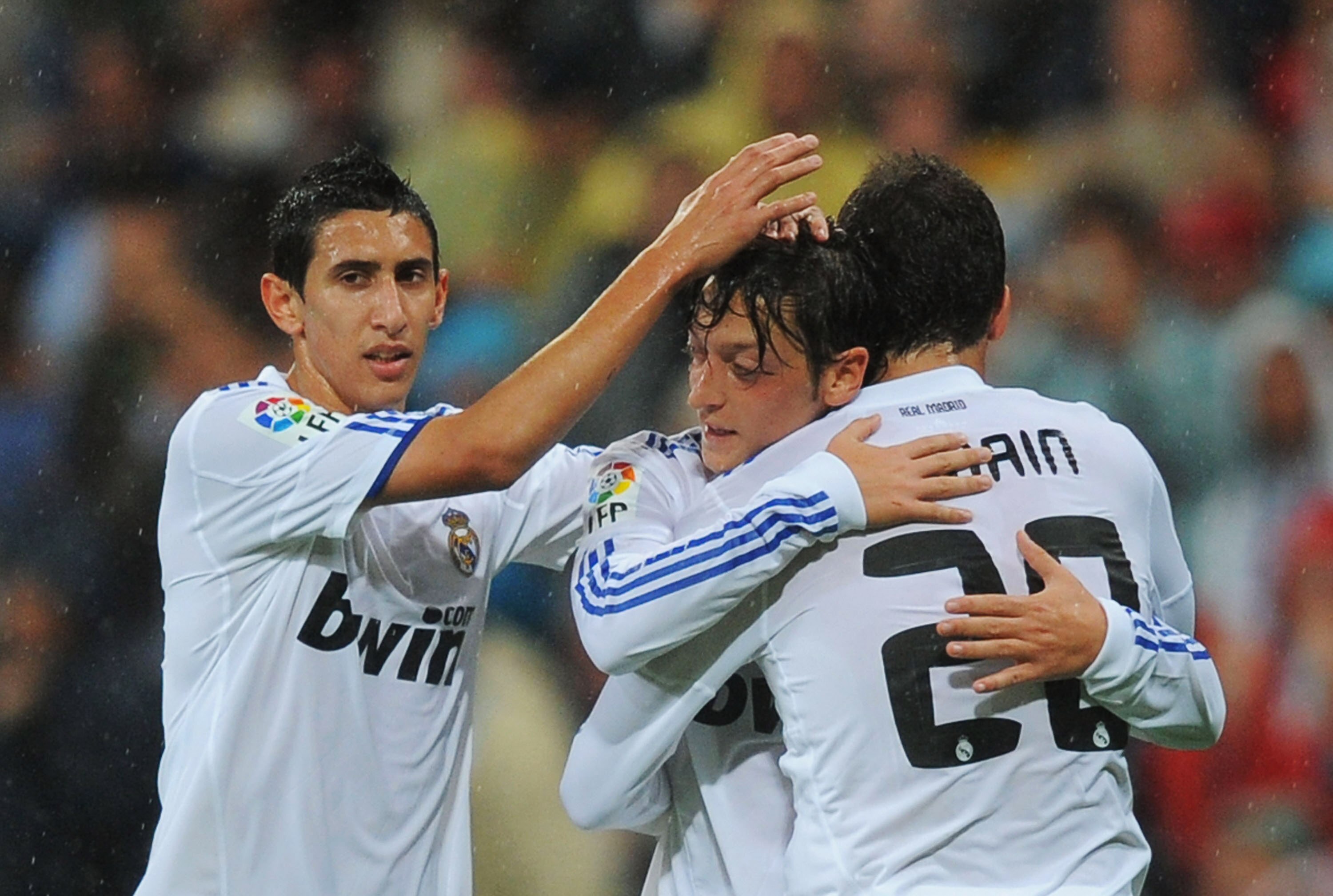 MADRID, SPAIN - OCTOBER 03:  Mesut Ozil (C) of Real Madrid is congratulated by Angel di Maria (L) and Gonzalo Higuain after scoring Real's 2nd goal  during the La Liga match between Real Madrid and Deportivo La Coruna at Estadio Santiago Bernabeu on Octob