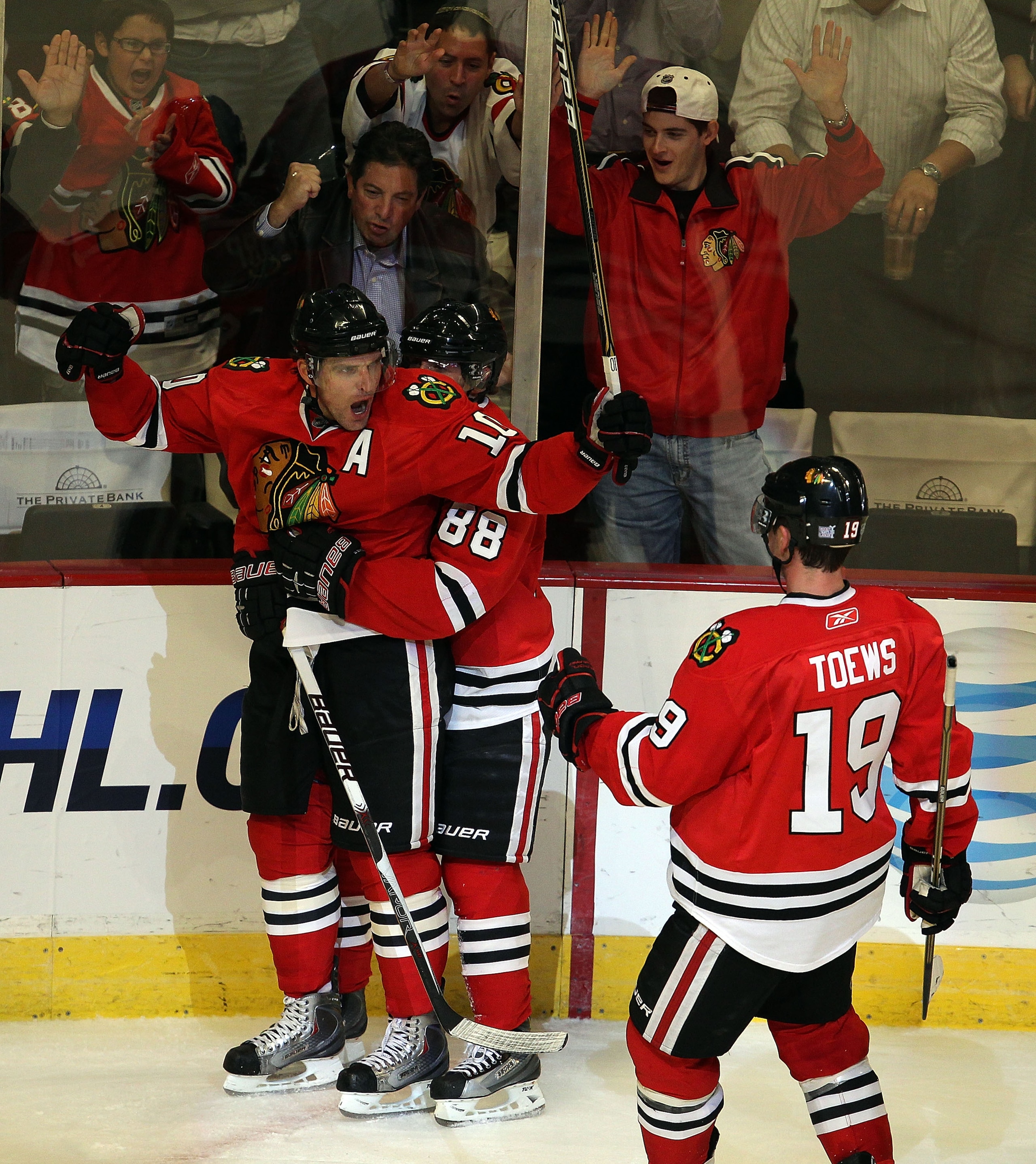 CHICAGO - OCTOBER 27: Patrick Sharp #10 of the Chicago Blackhawks get a hug from teammate Patrick Kane #88 as he celebrates a 3rd period goal against the Los Angeles Kings while Jonathan Toews skates to join them at the United Center on October 27, 2010 i CHICAGO - OCTOBER 27: Patrick Sharp #10 of the Chicago Blackhawks get a hug from teammate Patrick Kane #88 as he celebrates a 3rd period goal against the Los Angeles Kings while Jonathan Toews skates to join them at the United Center on October 27, 2010 i