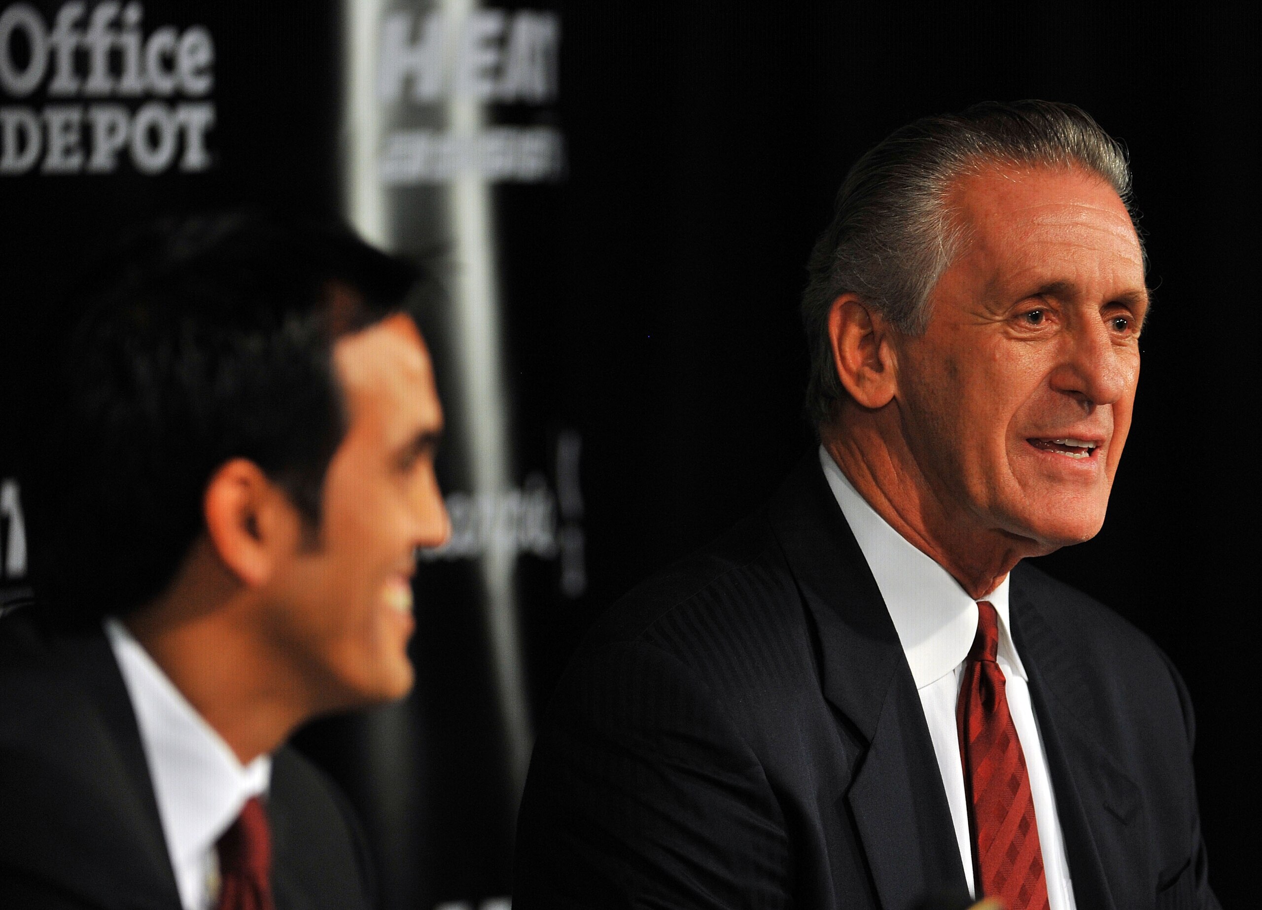MIAMI - JULY 09:  Head coach Erik Spoelstra (L) and President Pat Riley (R) of the Miami Heat talk during a press conference after a welcome party for new teammates LeBron James, Dwyane Wade, and Chris Bosh at American Airlines Arena on July 9, 2010 in Mi