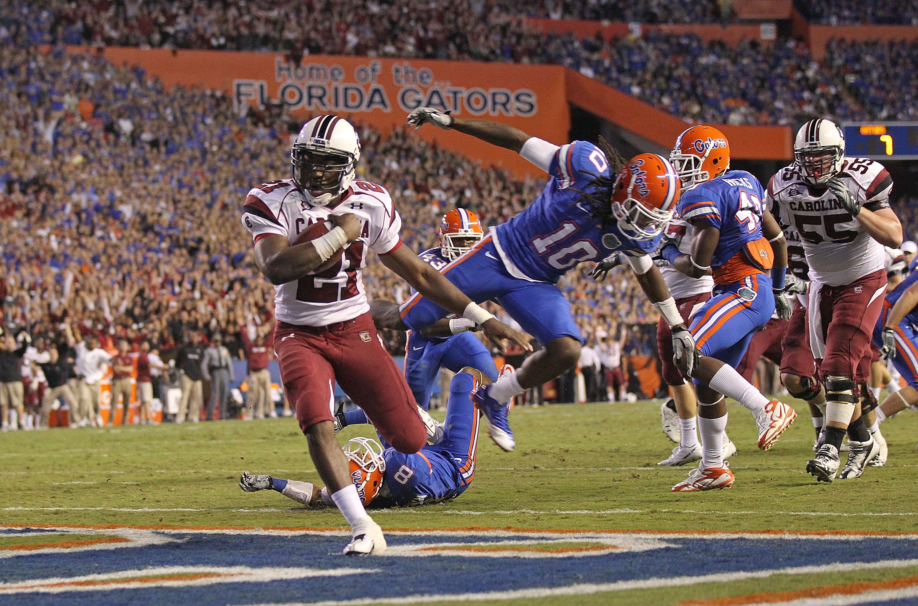 GAINESVILLE, FL - NOVEMBER 13:  Marcus Lattimore #21 of the South Carolina Gamecocks rushes for a touchdown during a game against the Florida Gators at Ben Hill Griffin Stadium on November 13, 2010 in Gainesville, Florida.  (Photo by Mike Ehrmann/Getty Im