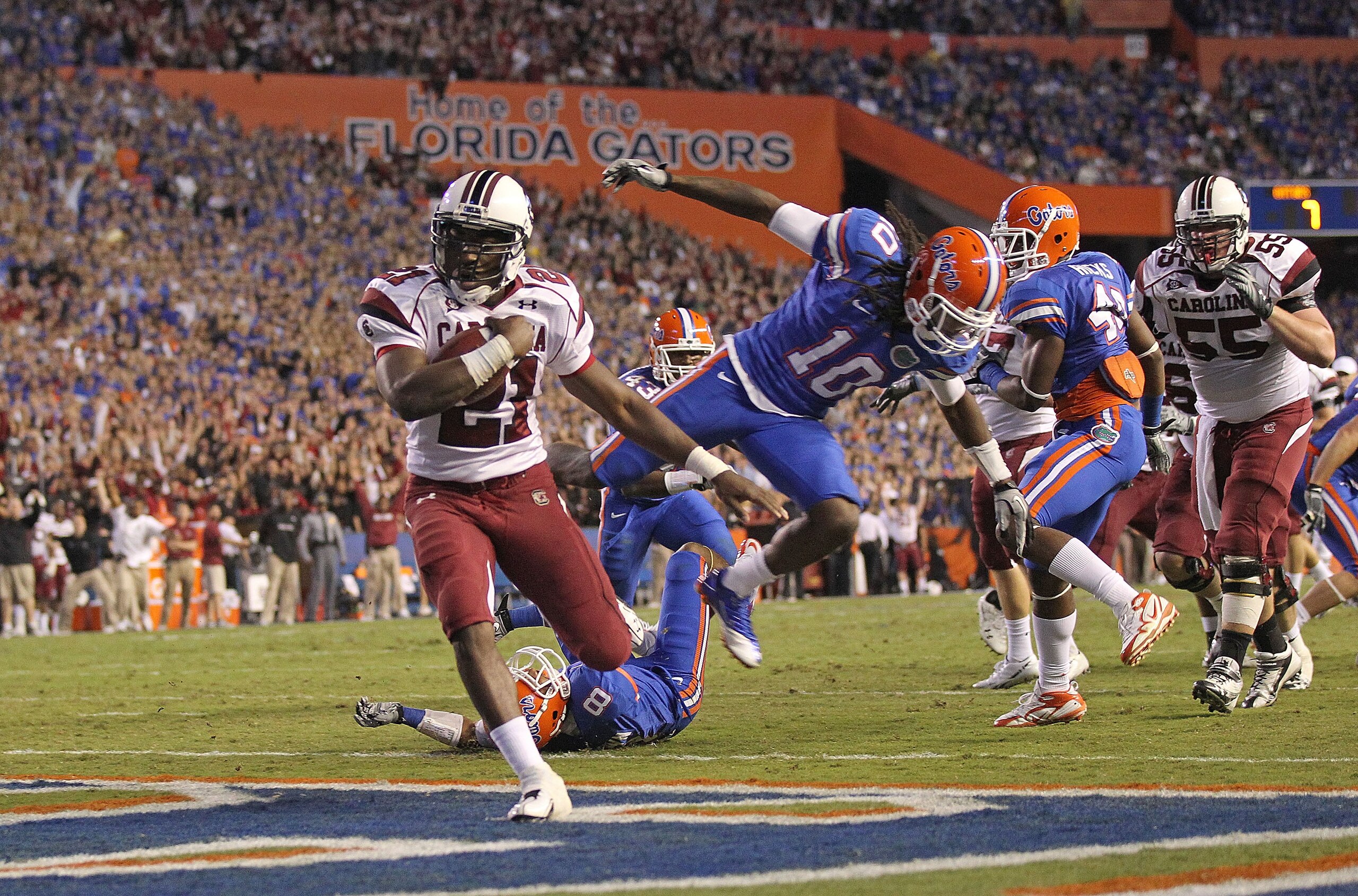 GAINESVILLE, FL - NOVEMBER 13:  Marcus Lattimore #21 of the South Carolina Gamecocks rushes for a touchdown during a game against the Florida Gators at Ben Hill Griffin Stadium on November 13, 2010 in Gainesville, Florida.  (Photo by Mike Ehrmann/Getty Im