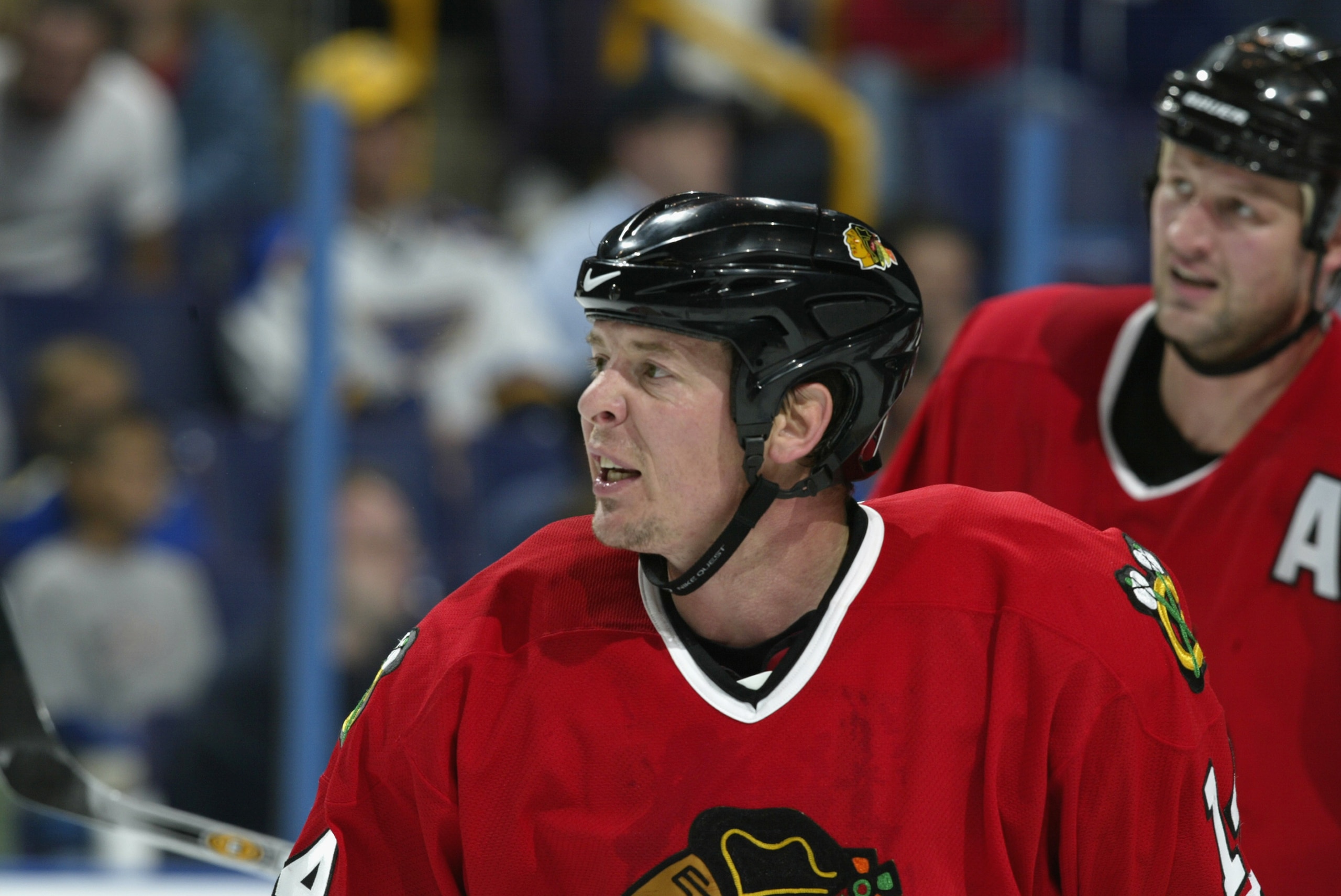 ST. LOUIS - OCTOBER 4:  Right wing Theo Fleury #14 of the Chicago Blackhawks looks on against the St. Louis Blues during the NHL preseason game on October 4, 2002 at the Savvis Center in St. Louis, Missouri.  The St. Louis Blues beat the Chicago Blackhawk
