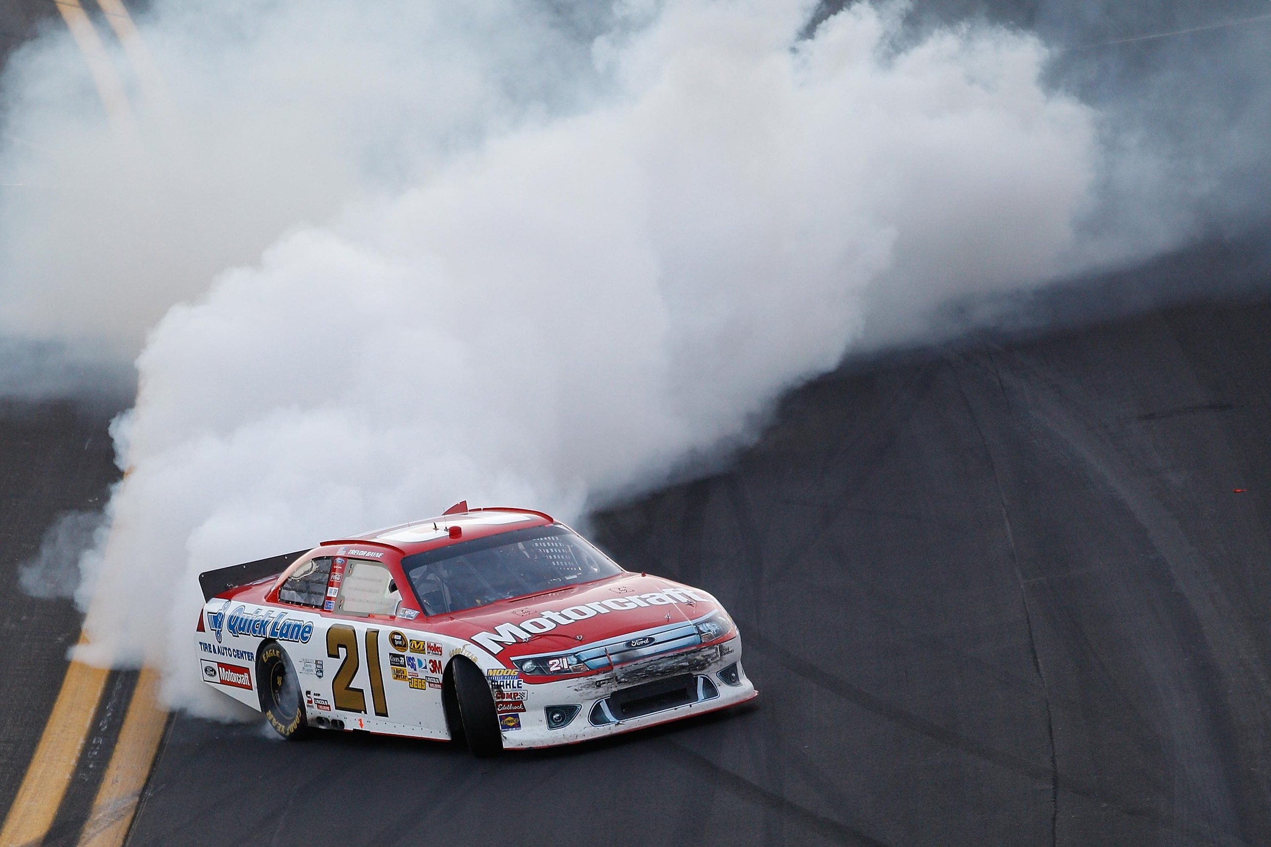 DAYTONA BEACH, FL - FEBRUARY 20: Trevor Bayne, driver of the #21 Motorcraft/Quick Lane Ford, celebrates after winning the NASCAR Sprint Cup Series Daytona 500 at Daytona International Speedway on February 20, 2011 in Daytona Beach, Florida. (Photo by Ch DAYTONA BEACH, FL - FEBRUARY 20: Trevor Bayne, driver of the #21 Motorcraft/Quick Lane Ford, celebrates after winning the NASCAR Sprint Cup Series Daytona 500 at Daytona International Speedway on February 20, 2011 in Daytona Beach, Florida. (Photo by Ch