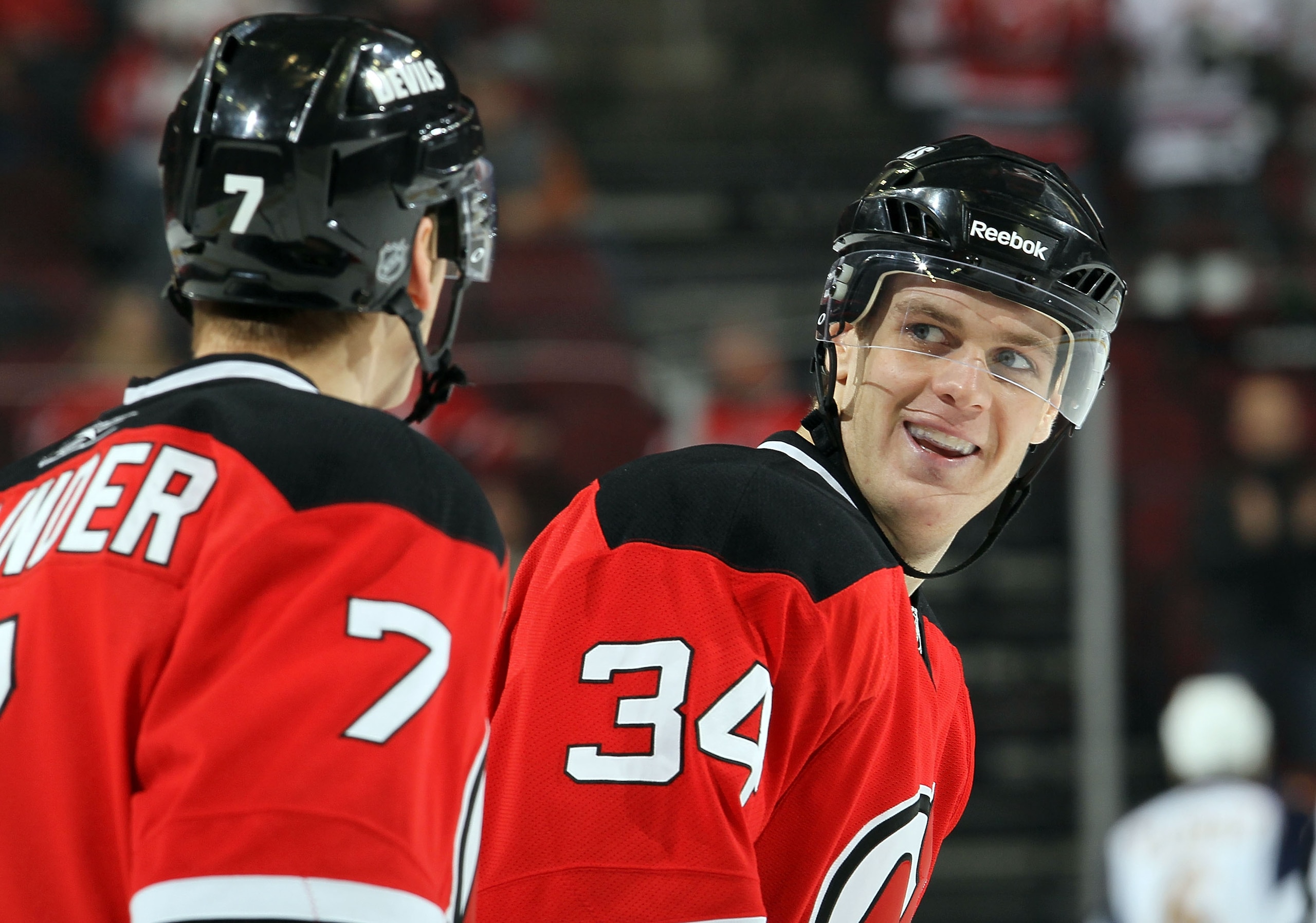 NEWARK, NJ - DECEMBER 31:  Mark Fayne #34 of the New Jersey Devils celebrates his goal against the Atlanta Thrashers with teammate Henrik Tallinder #7 at the Prudential Center on December 31, 2010 in Newark, New Jersey. The Devils defeated the Thrashers 3