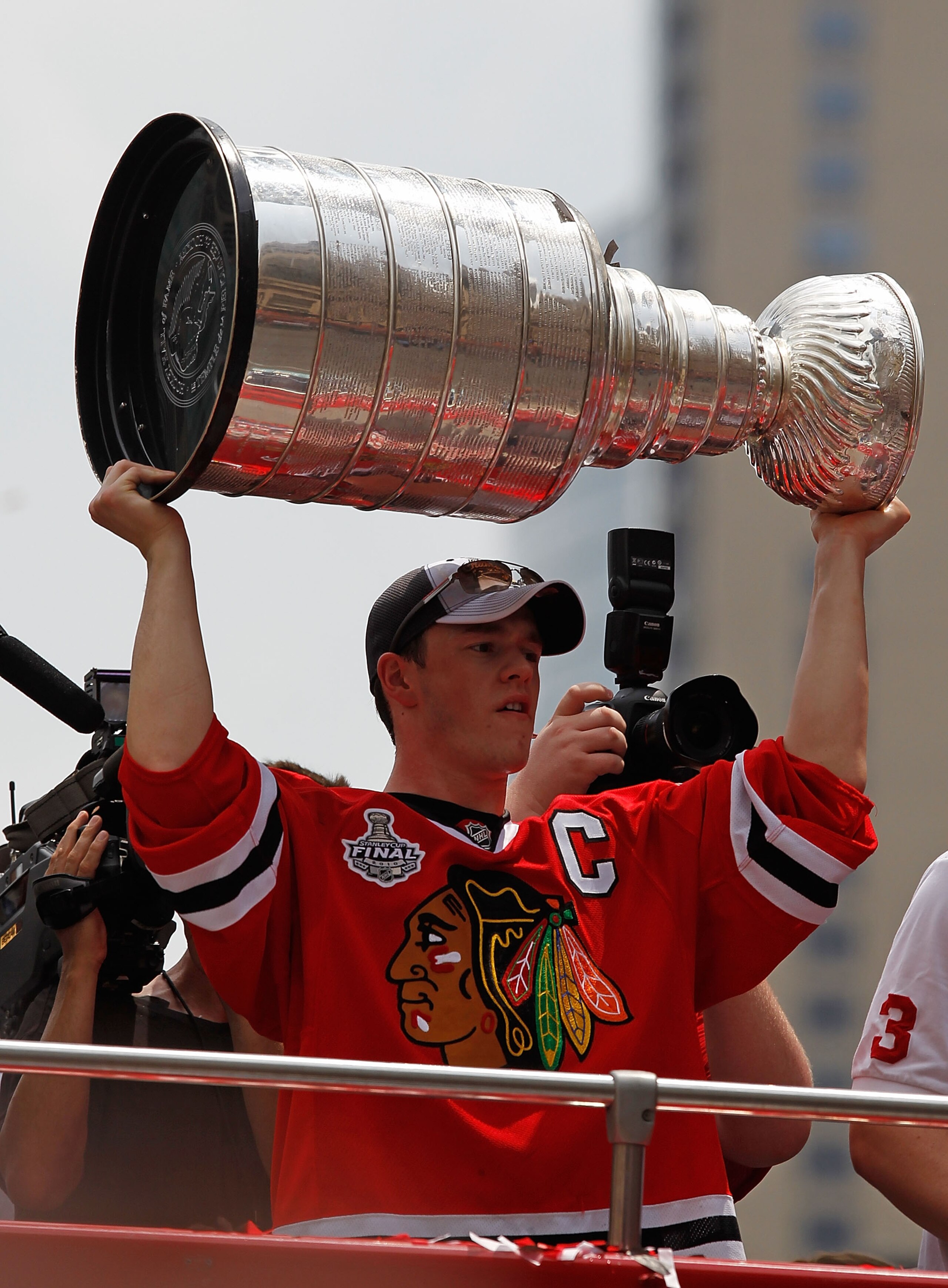 CHICAGO - JUNE 11: Jonathan Toews #19 holds up the Stanley Cup trophy during the Chicago Blackhawks Stanley Cup victory parade and rally on June 11, 2010 in Chicago, Illinois. (Photo by Jonathan Daniel/Getty Images) CHICAGO - JUNE 11: Jonathan Toews #19 holds up the Stanley Cup trophy during the Chicago Blackhawks Stanley Cup victory parade and rally on June 11, 2010 in Chicago, Illinois. (Photo by Jonathan Daniel/Getty Images)