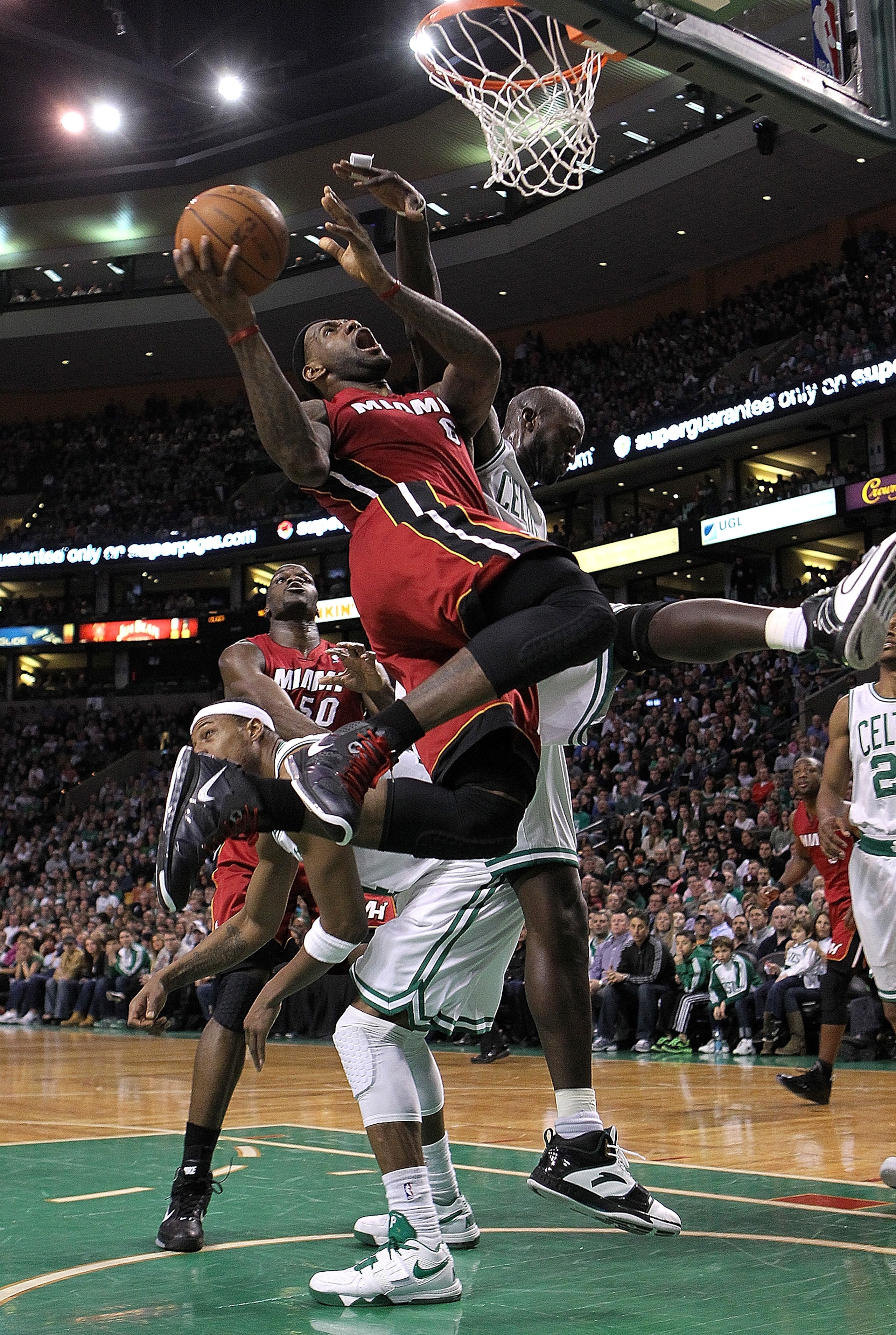 BOSTON - FEBRUARY 13:  LeBron James #6 of the Miami Heat drives  against Kevin Garnett #5 of the Boston Celtics at TD Garden on February 13, 2011 in Boston, Massachusetts. NOTE TO USER: User expressly acknowledges and agrees that, by downloading and/or us