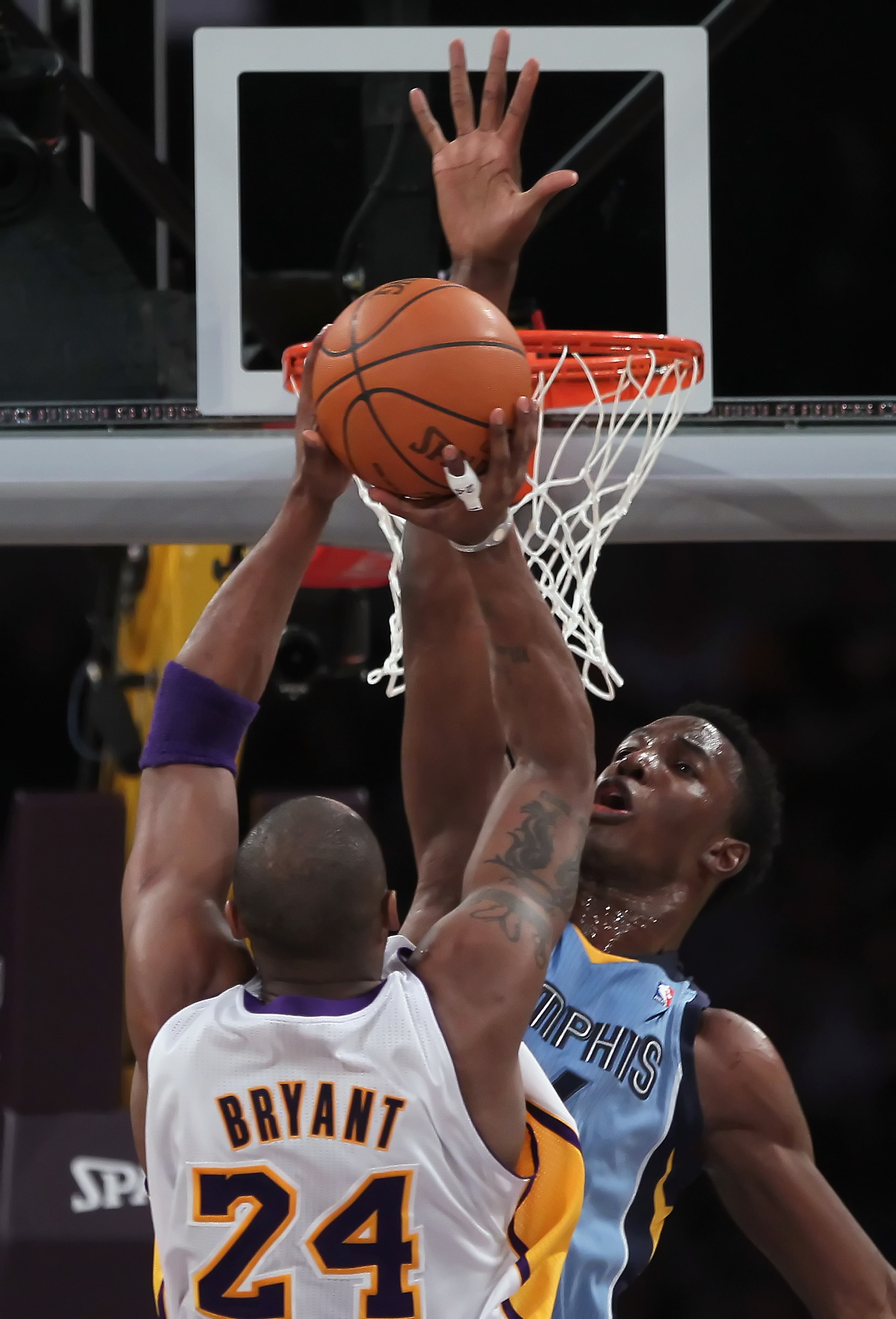LOS ANGELES, CA - JANUARY 02:  Hasheem Thabeet #34 of the Memphis Grizzlies goes up to block a shot by Kobe Bryant #24 of the Los Angeles Lakers during the first half at Staples Center on January 2, 2011 in Los Angeles, California. The Grizzlies defeated