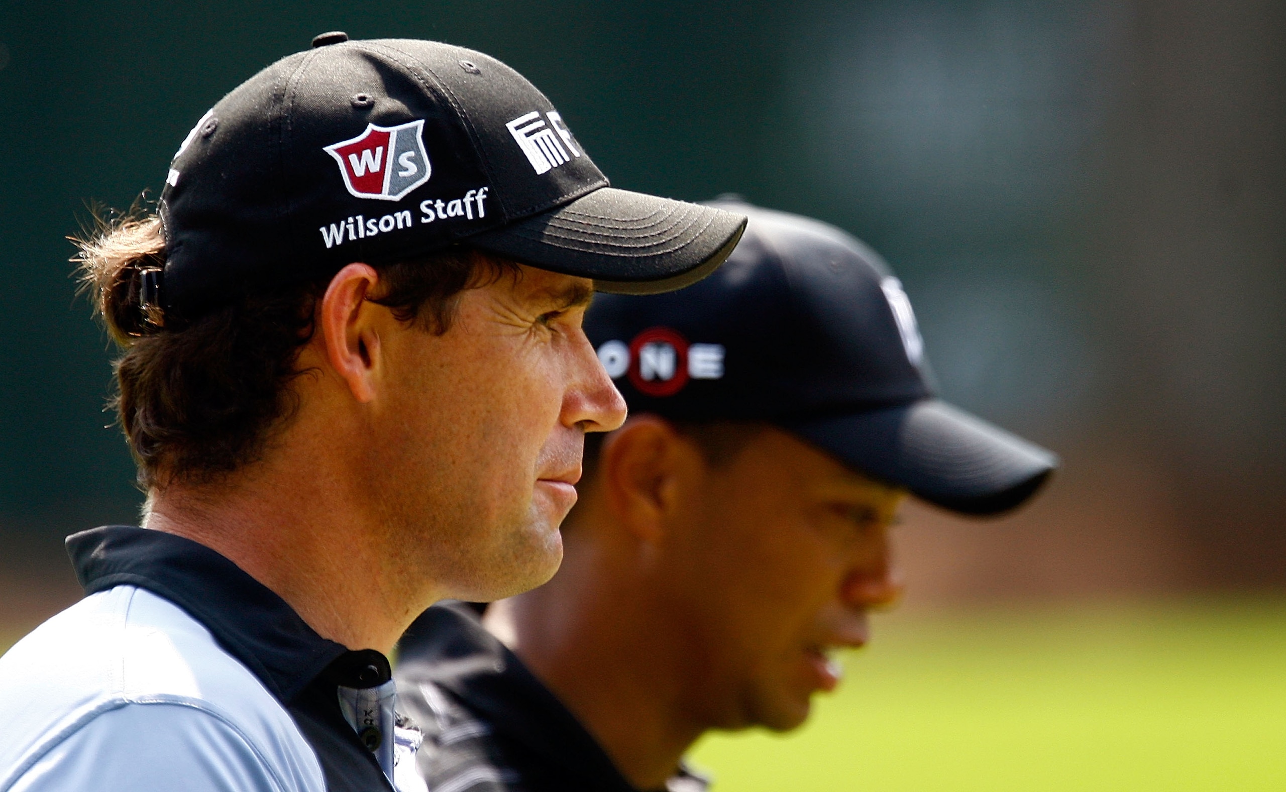 ATLANTA - SEPTEMBER 26:  Padraig Harrington of Ireland (L) walks alongside Tiger Woods on the 16th hole during the third round of THE TOUR Championship presented by Coca-Cola, the final event of the PGA TOUR Playoffs for the FedEx Cup, at East Lake Golf C