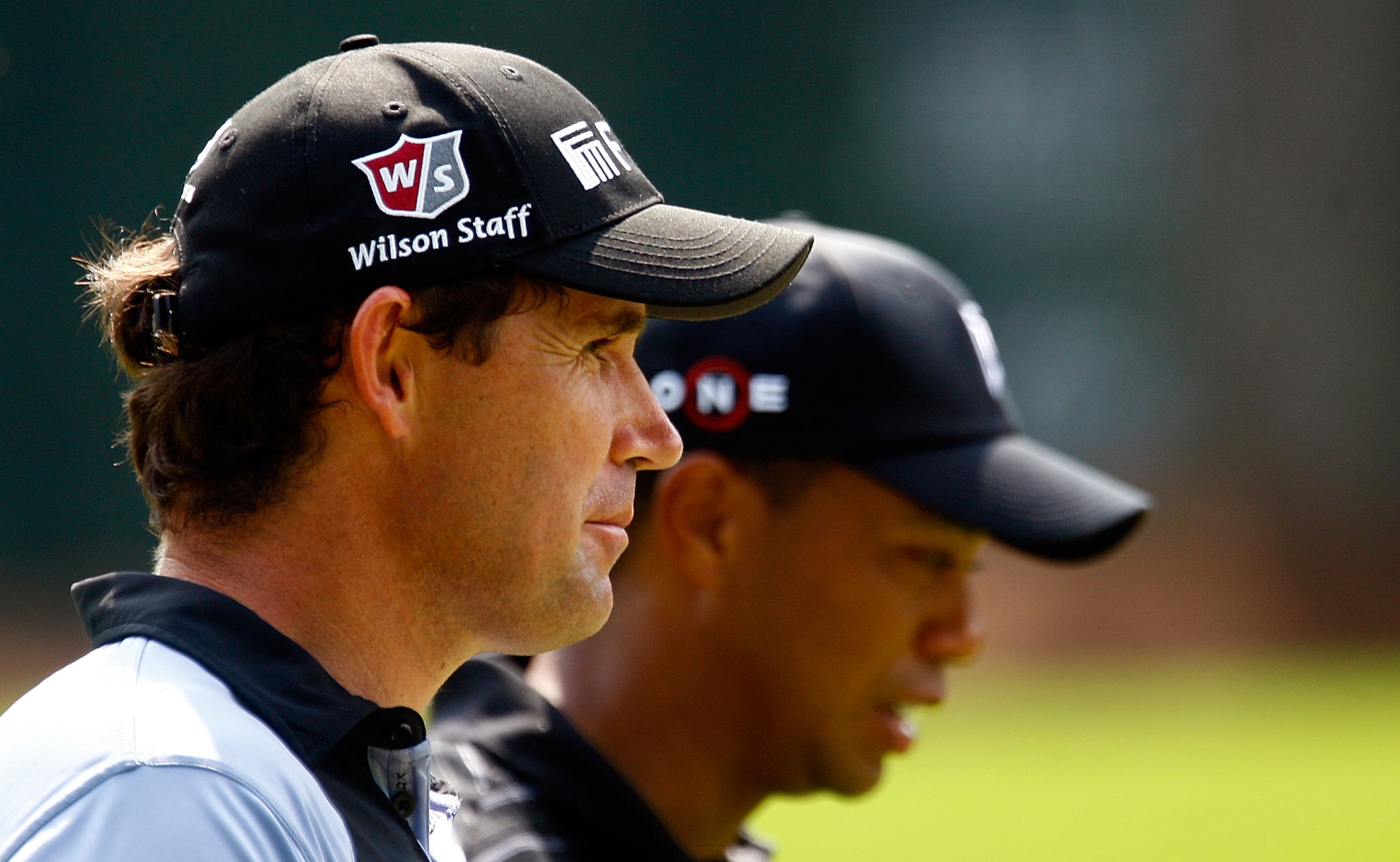 ATLANTA - SEPTEMBER 26: Padraig Harrington of Ireland (L) walks alongside Tiger Woods on the 16th hole during the third round of THE TOUR Championship presented by Coca-Cola, the final event of the PGA TOUR Playoffs for the FedEx Cup, at East Lake Golf C ATLANTA - SEPTEMBER 26: Padraig Harrington of Ireland (L) walks alongside Tiger Woods on the 16th hole during the third round of THE TOUR Championship presented by Coca-Cola, the final event of the PGA TOUR Playoffs for the FedEx Cup, at East Lake Golf C