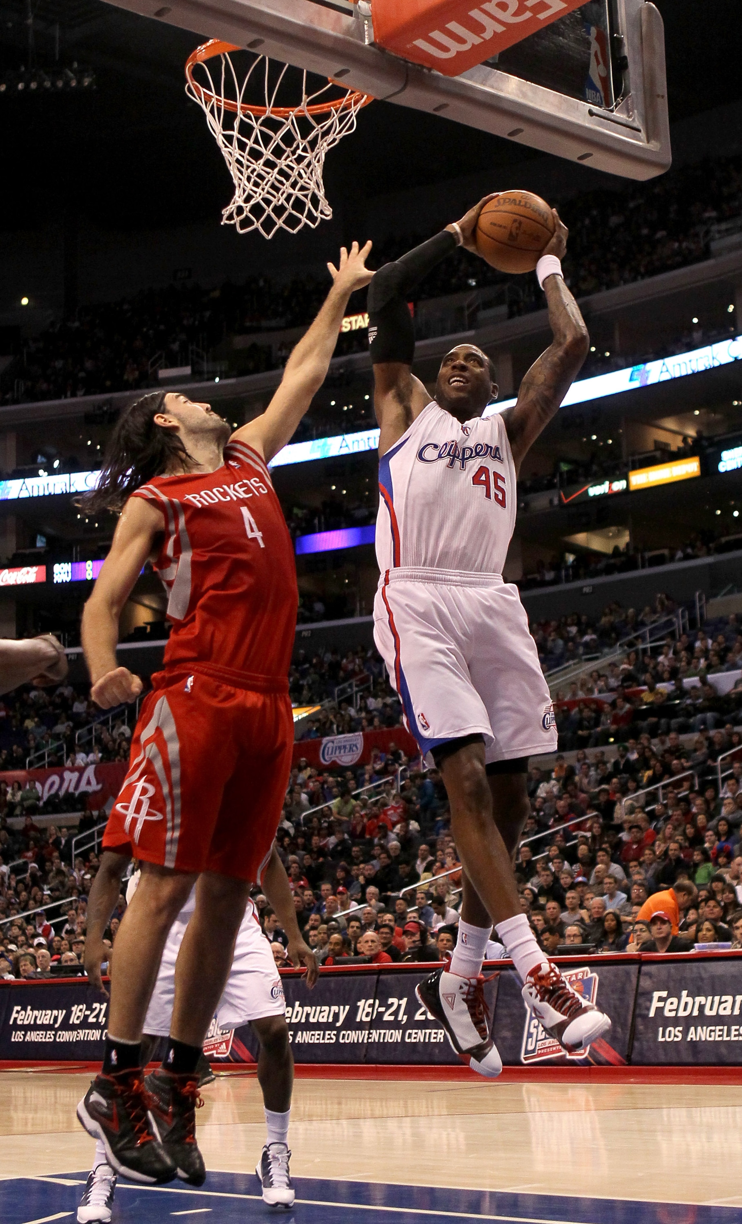 LOS ANGELES, CA - DECEMBER 22:   Rasual Butler #45 of the Los Angeles Clippers grabs a rebound against Luis Scola #4 of the Houston Rockets at Staples Center on December 22, 2010 in Los Angeles, California.  The Rockets won 97-92. NOTE TO USER: User expre
