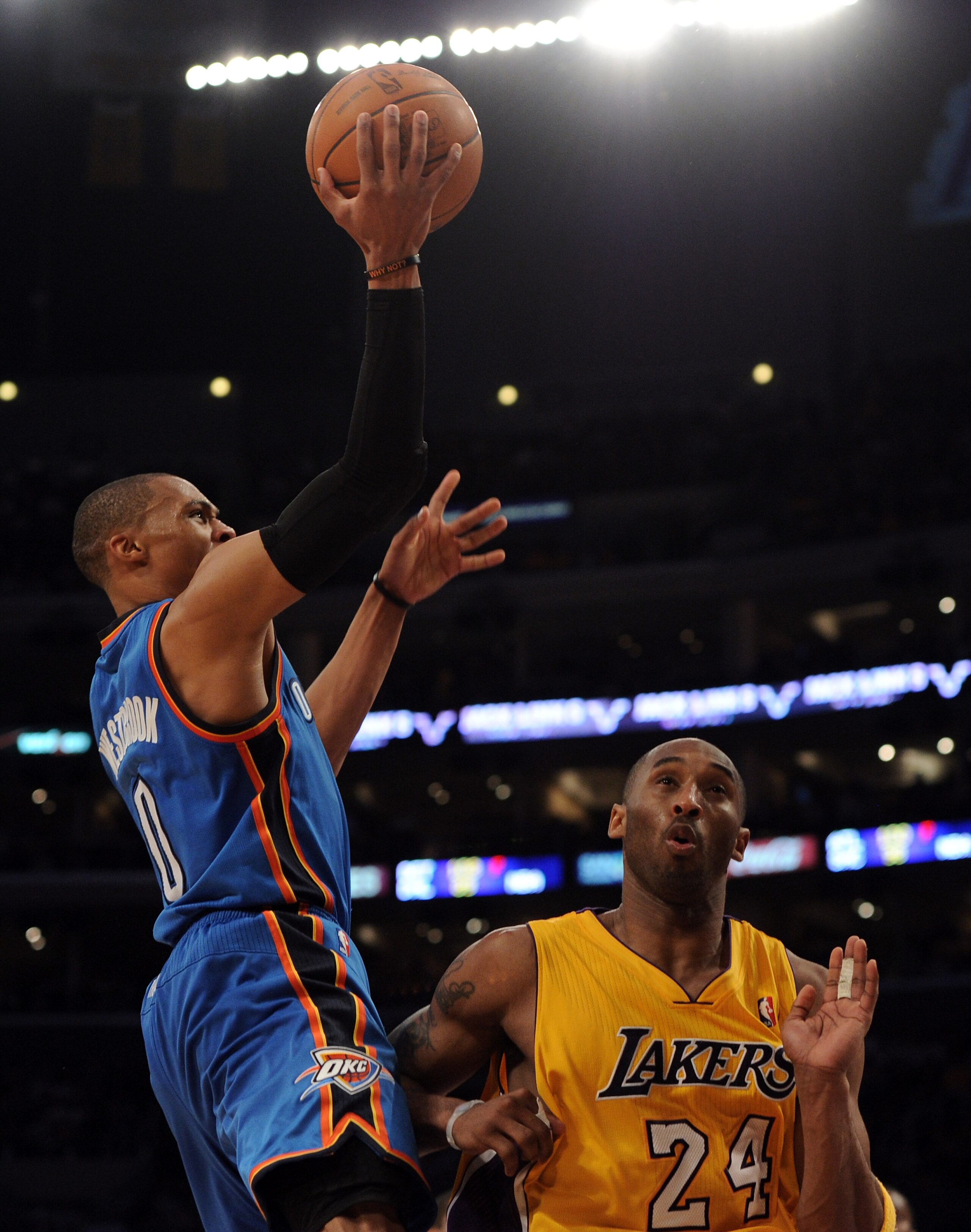 LOS ANGELES, CA - JANUARY 17:  Russell Westbrook #0 of the Oklahoma City Thunder goes in for a layup in front of Kobe Bryant #24 of the Los Angeles Lakers during a 101-94 Laker win at the Staples Center on January 17, 2011 in Los Angeles, California.   NO