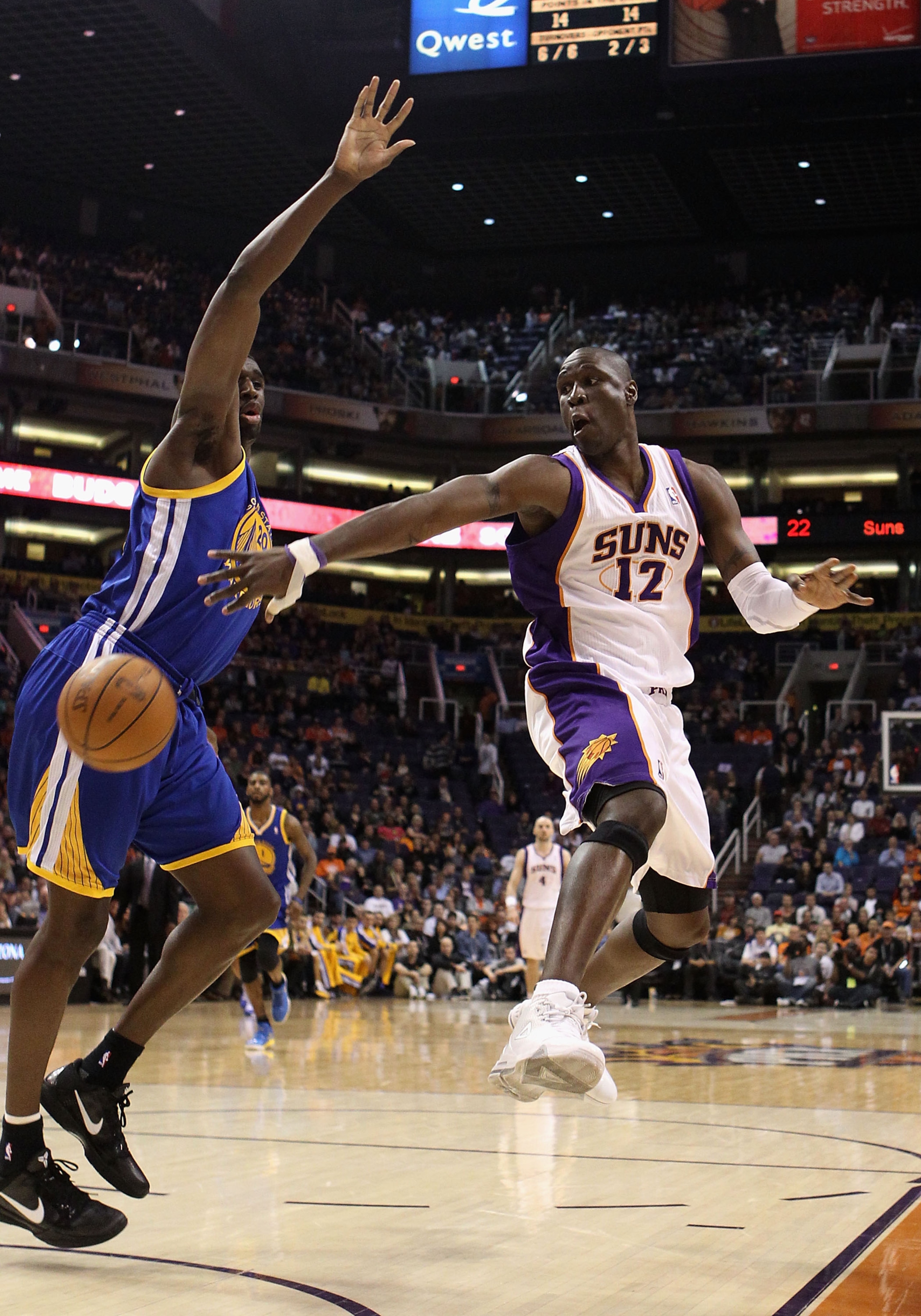PHOENIX, AZ - FEBRUARY 10:  Mickael Pietrus #12 of the Phoenix Suns passes the ball during the NBA game against the Golden State Warriors at US Airways Center on February 10, 2011 in Phoenix, Arizona.  The Suns defeated the Warriors 112-88.  NOTE TO USER: