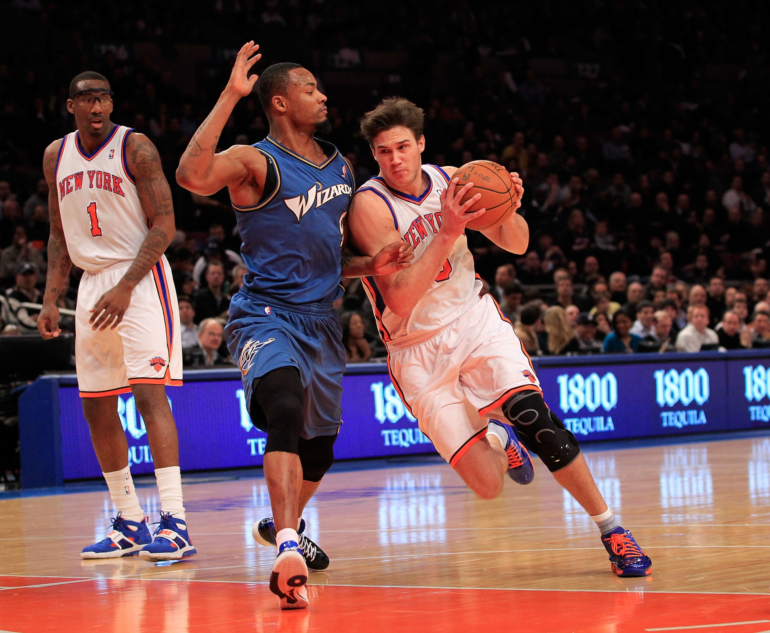 NEW YORK, NY - JANUARY 24: Danilo Gallinari #8 of the New York Knicks drives past Rashard Lewis #9 of the Washington Wizards at Madison Square Garden on January 24, 2011 in New York City. NOTE TO USER: User expressly acknowledges and agrees that, by downl