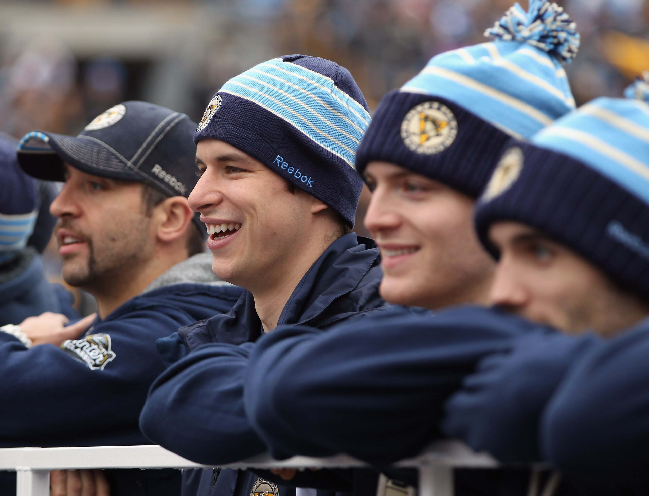PITTSBURGH, PA - DECEMBER 31:  Sydney Crosby #87 of the Pittsburgh Pengiuns watches the 2011 NHL Winter Classic Alumni Game against the Washington Capitals alongside Max Talbot #25 and Mark Letestu #10 on December 31, 2010 at Heinz Field in Pittsburgh, Pe