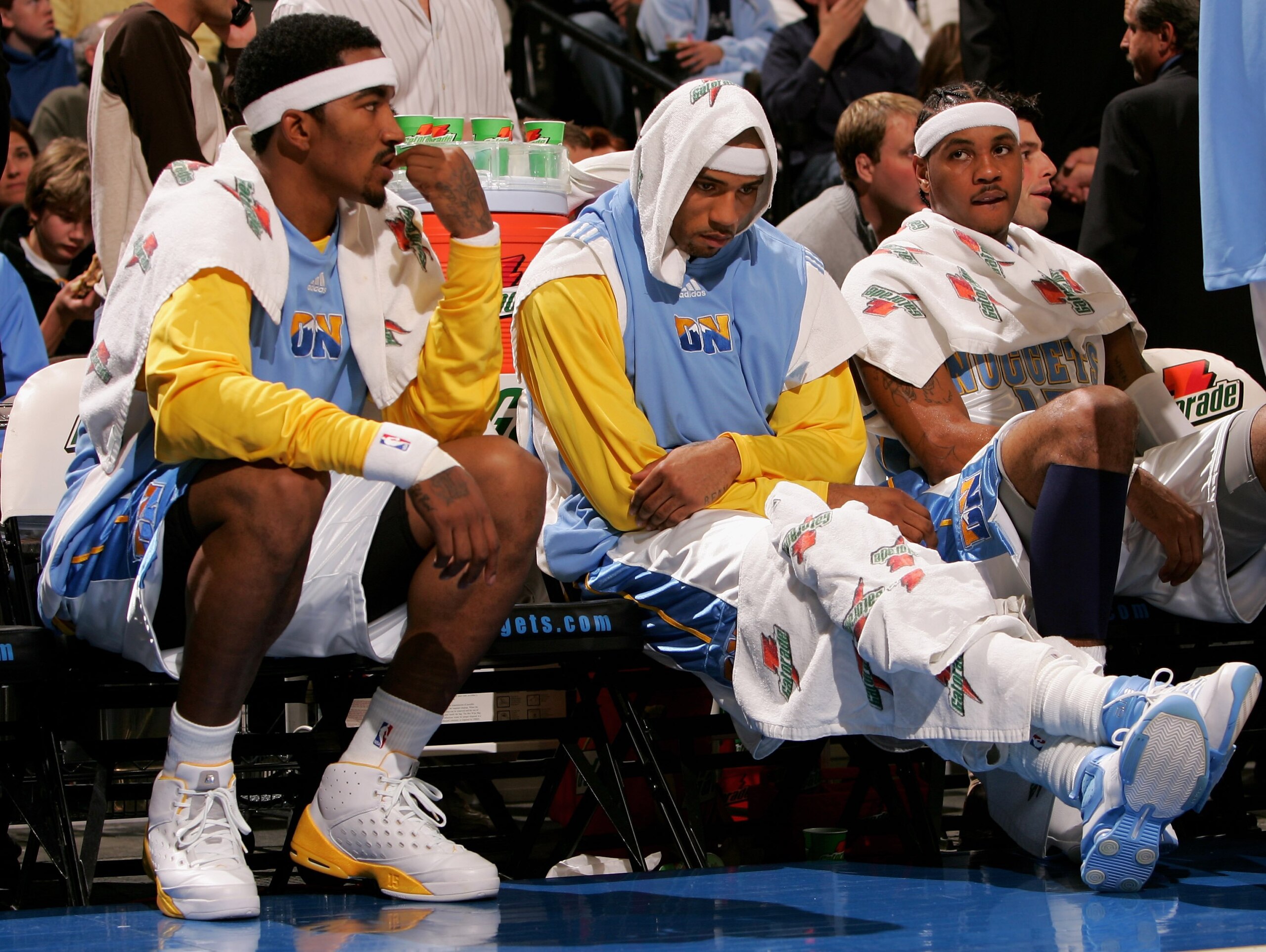 DENVER - NOVEMBER 03:  J.R. Smith #1, Kenyon Martin #6 and Carmelo Anthony #15 of the Denver Nuggets sit on the bench as the Minnesota Timberwolves defeated the Nuggets 112-109 on November 3, 2006 at the Pepsi Center in Denver, Colorado. NOTE TO USER: Use