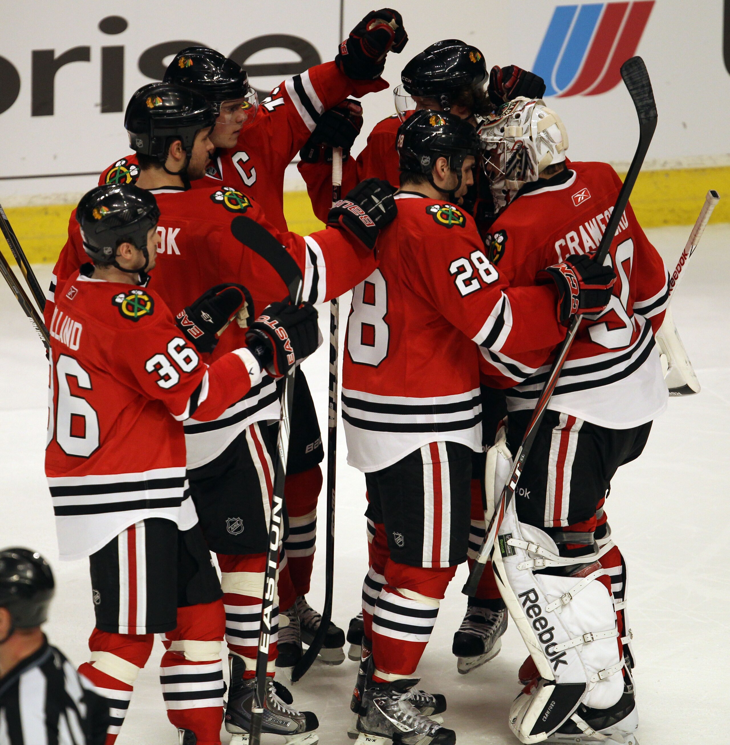 CHICAGO, IL - FEBRUARY 20: Members of the Chicago Blackhawks including Dave Bolland #36, Brent Seabrook #7, Jonathan Toews #19 and Jake Dowell #28 congratulate teammate Corey Crawford #50 after a win over the Pittsburgh Penguins at the United Center on Fe CHICAGO, IL - FEBRUARY 20: Members of the Chicago Blackhawks including Dave Bolland #36, Brent Seabrook #7, Jonathan Toews #19 and Jake Dowell #28 congratulate teammate Corey Crawford #50 after a win over the Pittsburgh Penguins at the United Center on Fe