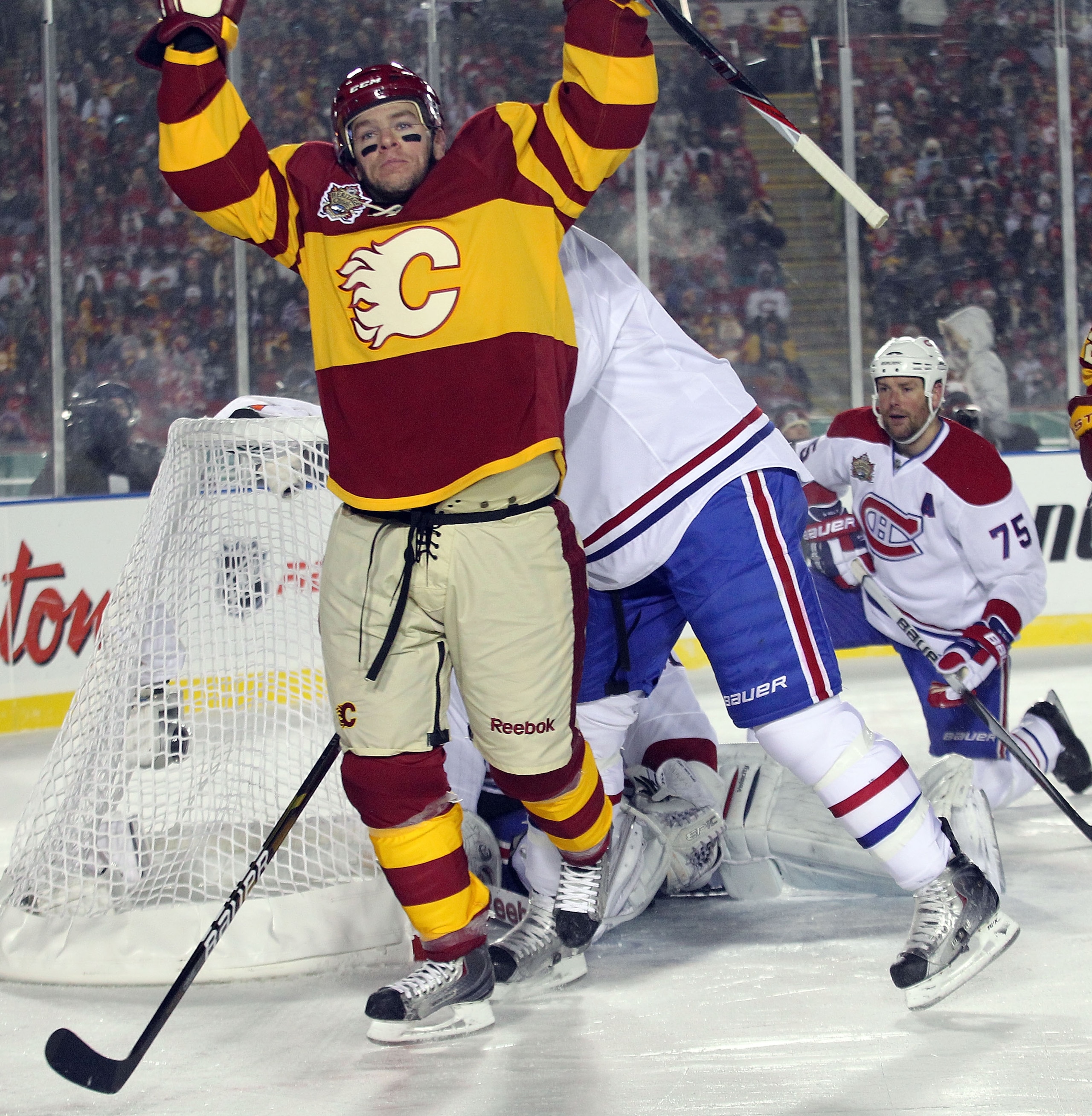 CALGARY, AB - FEBRUARY 20: Alex Tanguay #40 of the Calgary Flames celebrates his goal at 10:53 of the third period during the 2011 NHL Heritage Classic Game at McMahon Stadium on February 20, 2011 in Calgary, Alberta, Canada. The Flames defeated the Cana CALGARY, AB - FEBRUARY 20: Alex Tanguay #40 of the Calgary Flames celebrates his goal at 10:53 of the third period during the 2011 NHL Heritage Classic Game at McMahon Stadium on February 20, 2011 in Calgary, Alberta, Canada. The Flames defeated the Cana