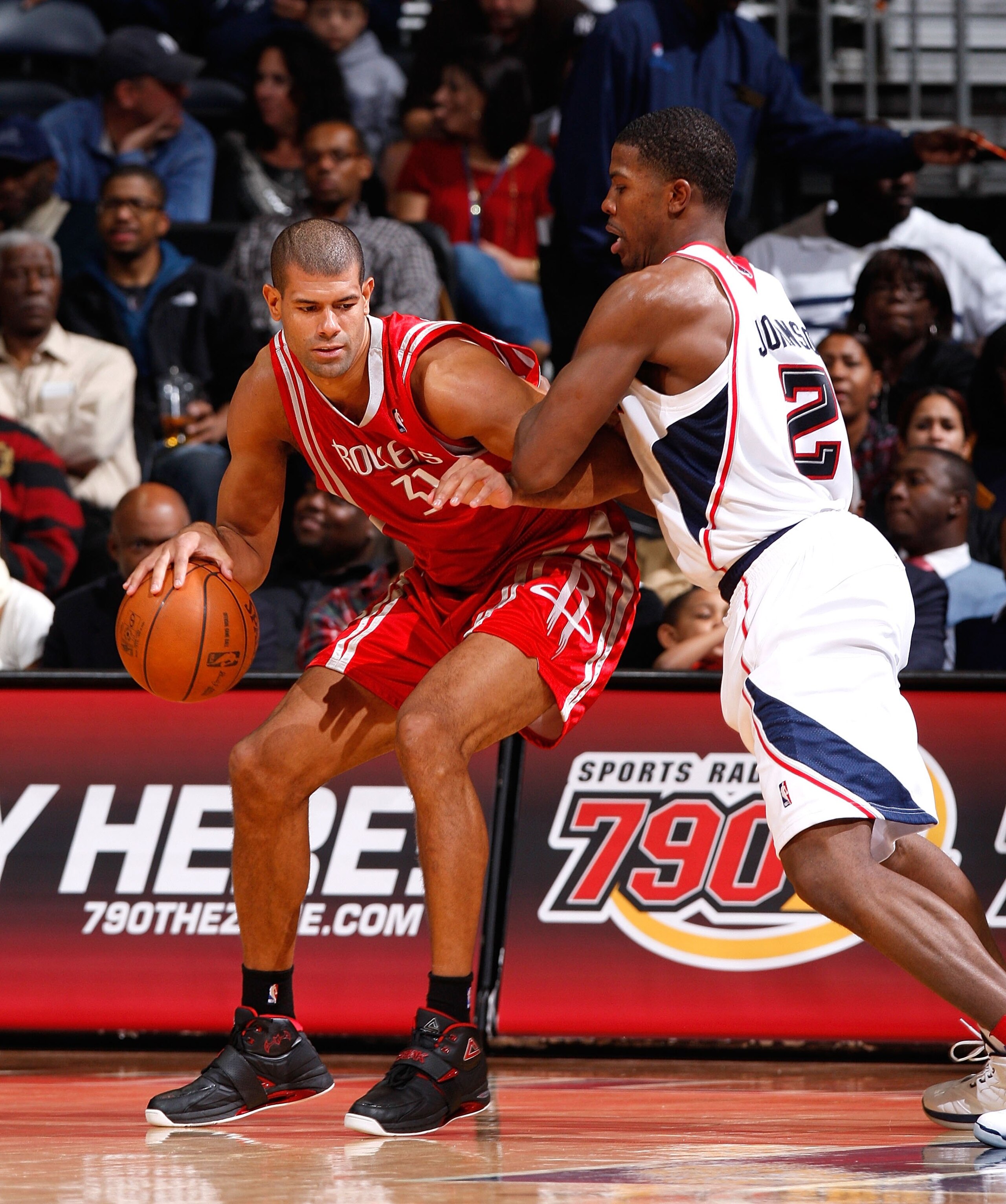 ATLANTA - NOVEMBER 20:  Shane Battier #31 of the Houston Rockets against Joe Johnson #2 of the Atlanta Hawks at Philips Arena on November 20, 2009 in Atlanta, Georgia.  NOTE TO USER: User expressly acknowledges and agrees that, by downloading and/or using