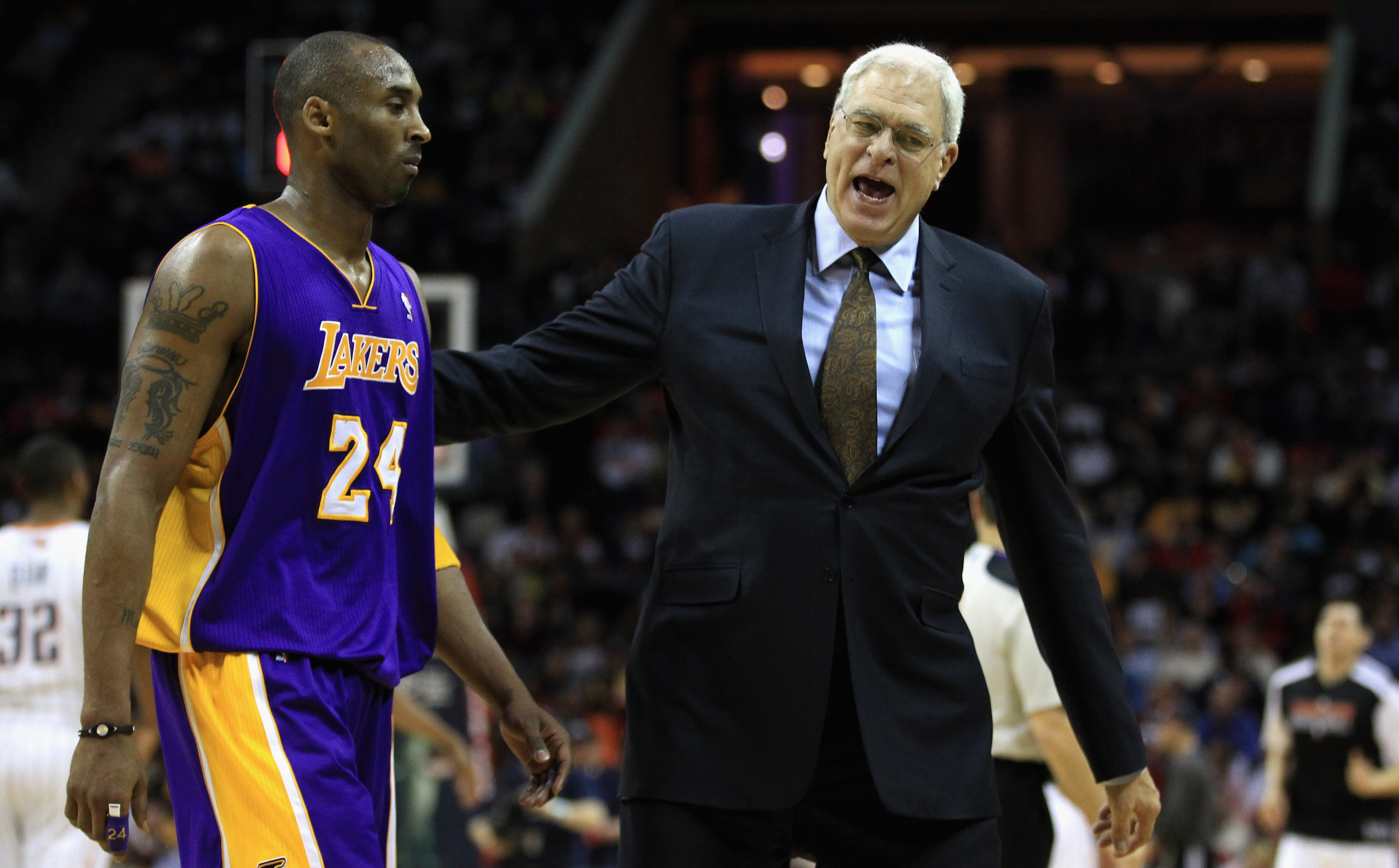 CHARLOTTE, NC - FEBRUARY 14:  Head coach Phil Jackson talks to Kobe Bryant #24 of the Los Angeles Lakers during their game against the Charlotte Bobcats at Time Warner Cable Arena on February 14, 2011 in Charlotte, North Carolina. NOTE TO USER: User expre