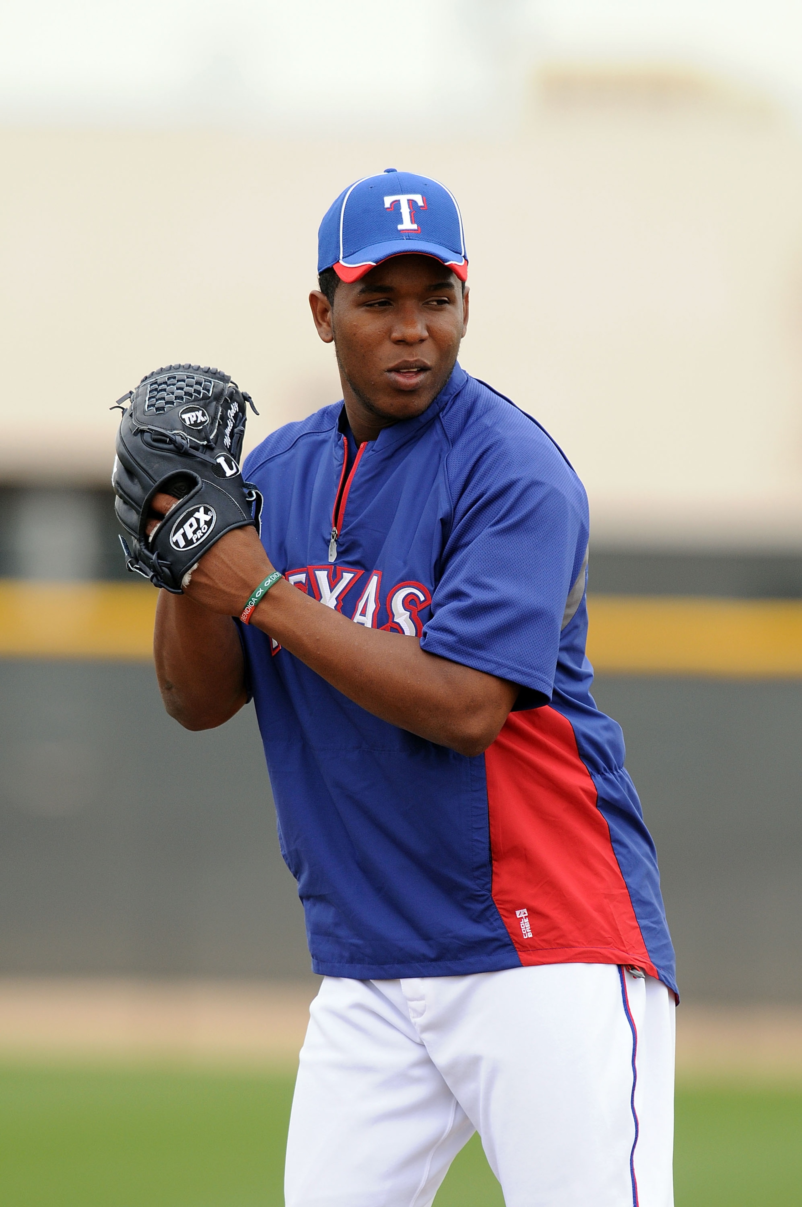 SURPRISE, AZ - FEBRUARY 18:  Neftali Feliz #30 of the Texas Rangers gets ready to deliver a pitch at Surprise Stadium on February 18, 2011 in Surprise, Arizona.  (Photo by Norm Hall/Getty Images)